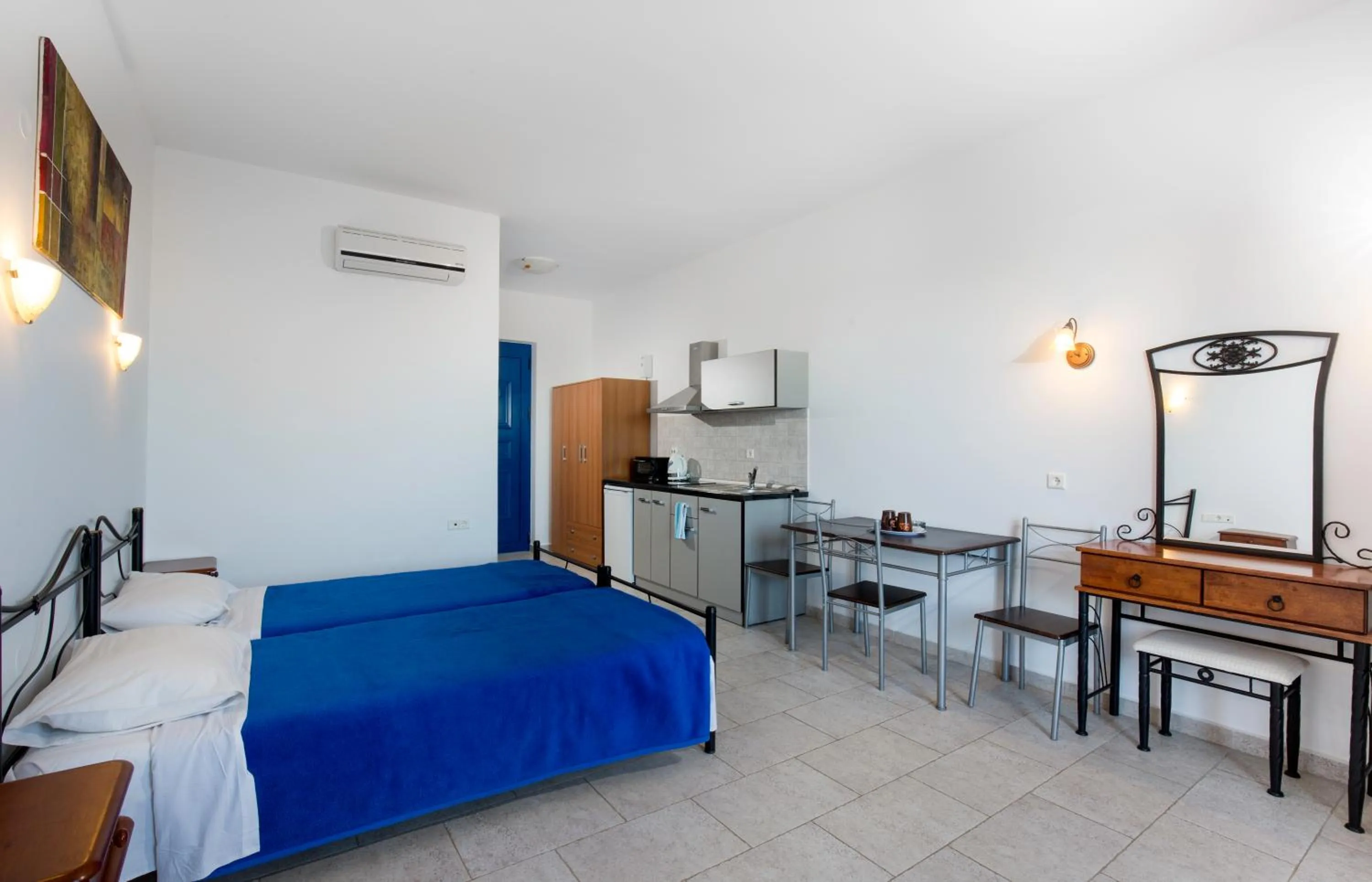 Bed in 'Lindian Myth' Sea View Studios