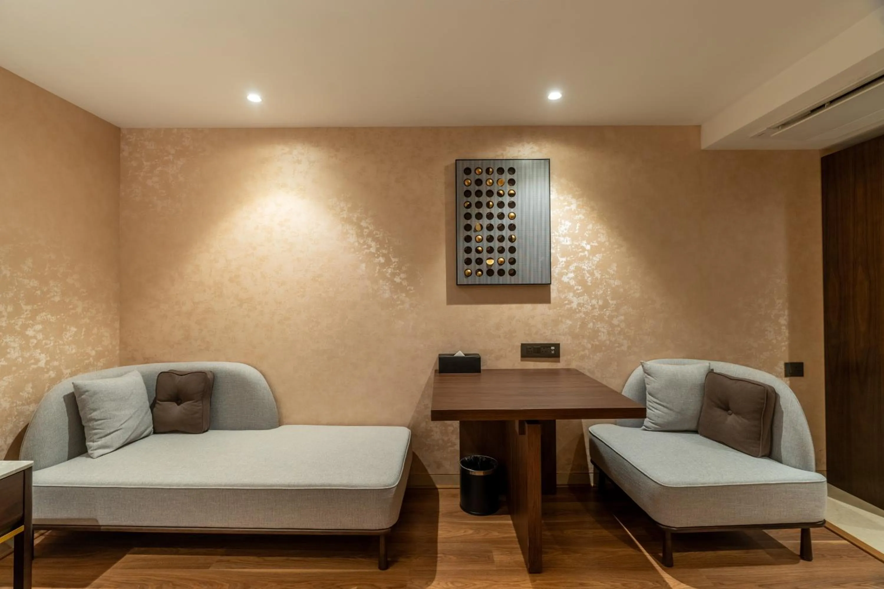 Seating area, Bed in Clarks Inn Suites Hyderabad Airport