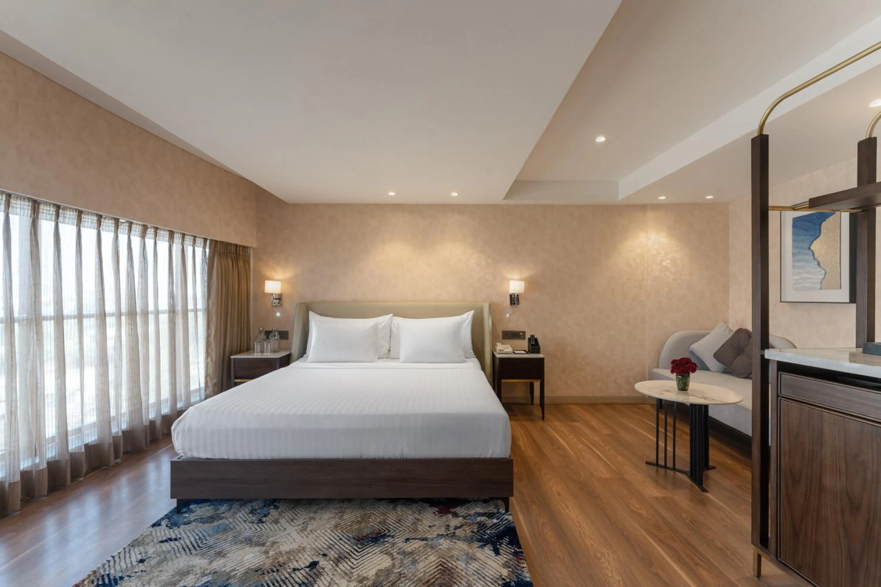 Photo of the whole room, Bed in Clarks Inn Suites Hyderabad Airport