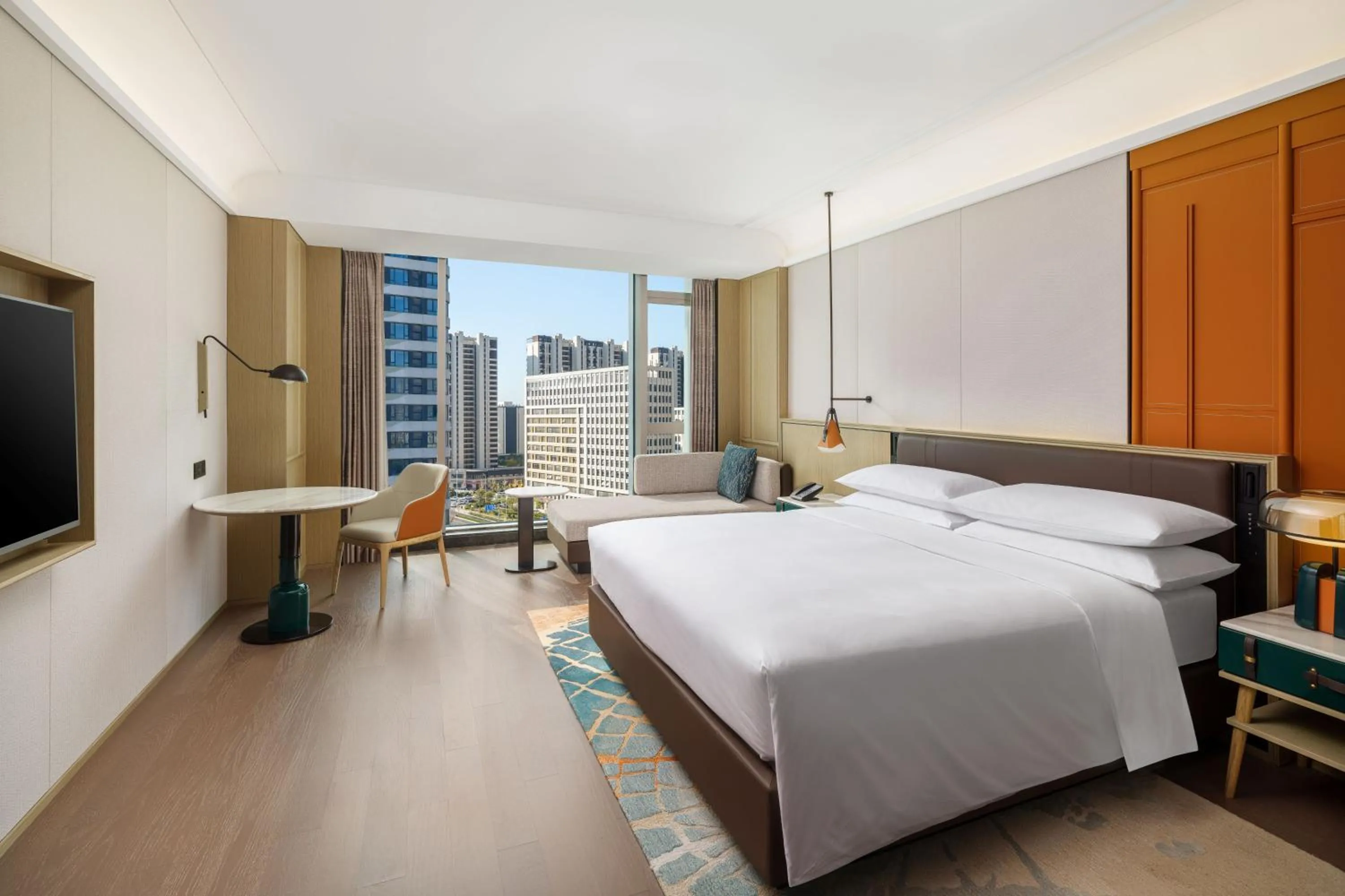 Bed in Renaissance Qingdao Hotel