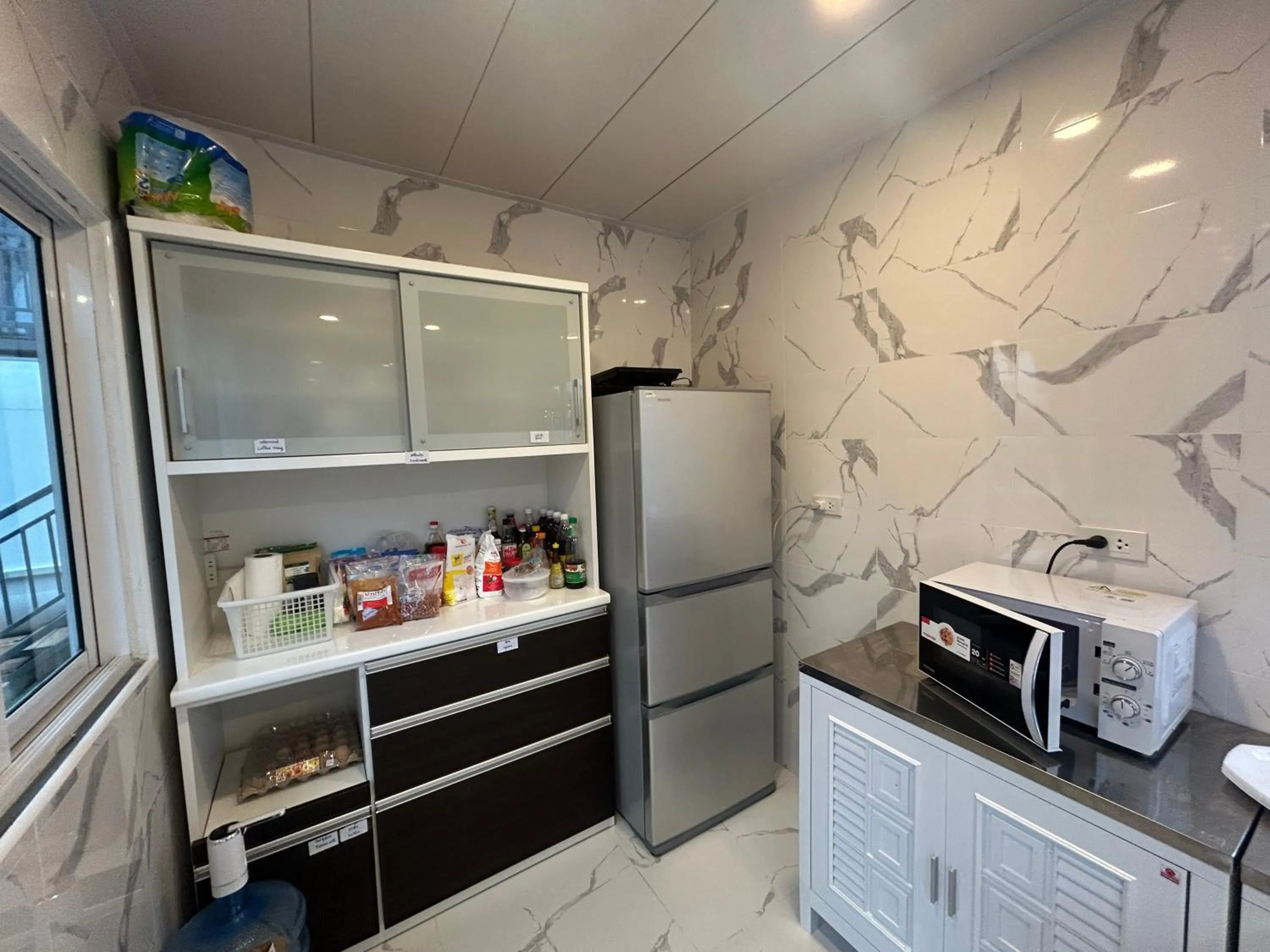 Communal kitchen in Space House Hotel Phuket