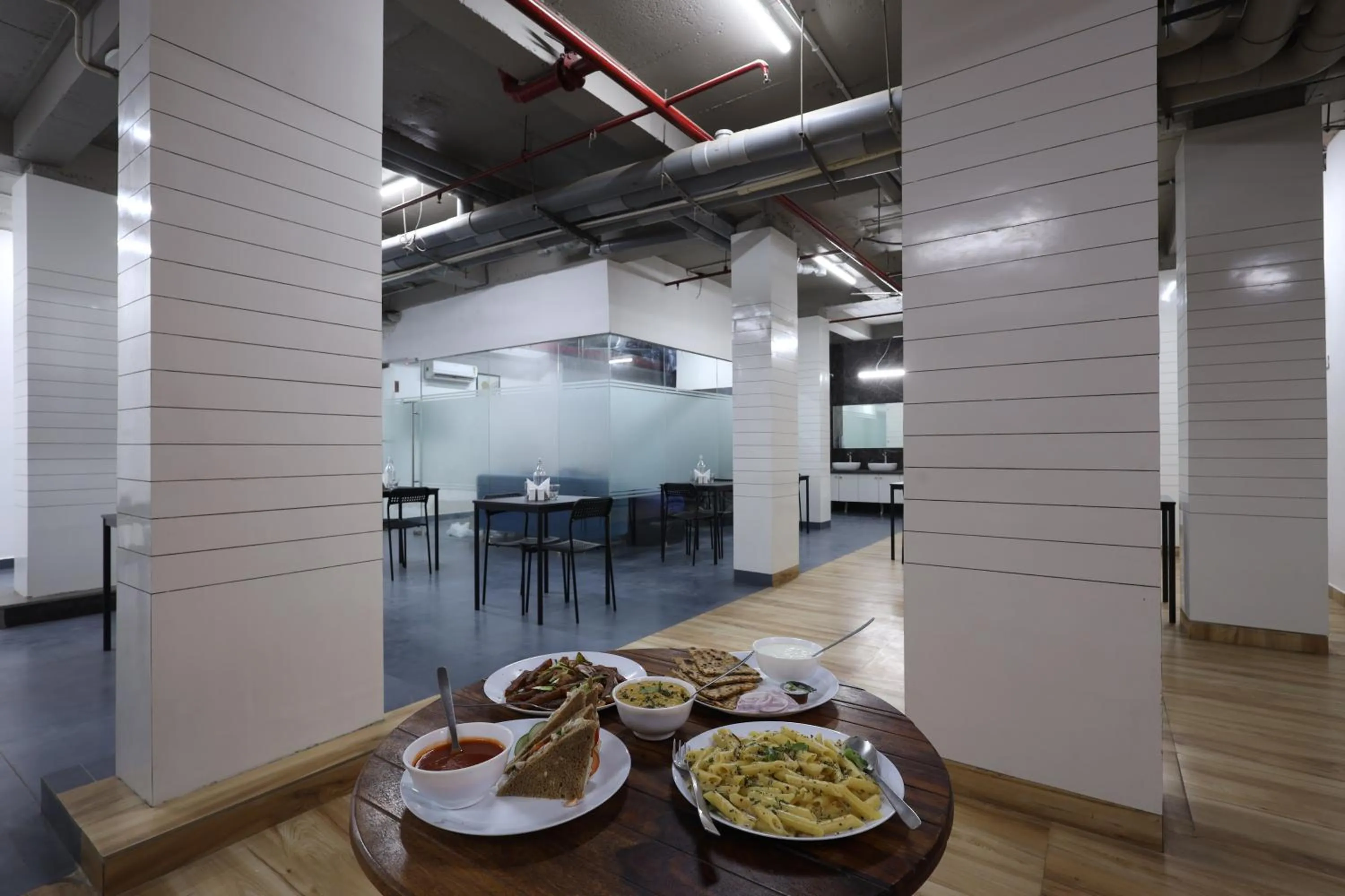 Dining area in Wandr Hotel Medicity Gurugram, Near Medanta Hospital