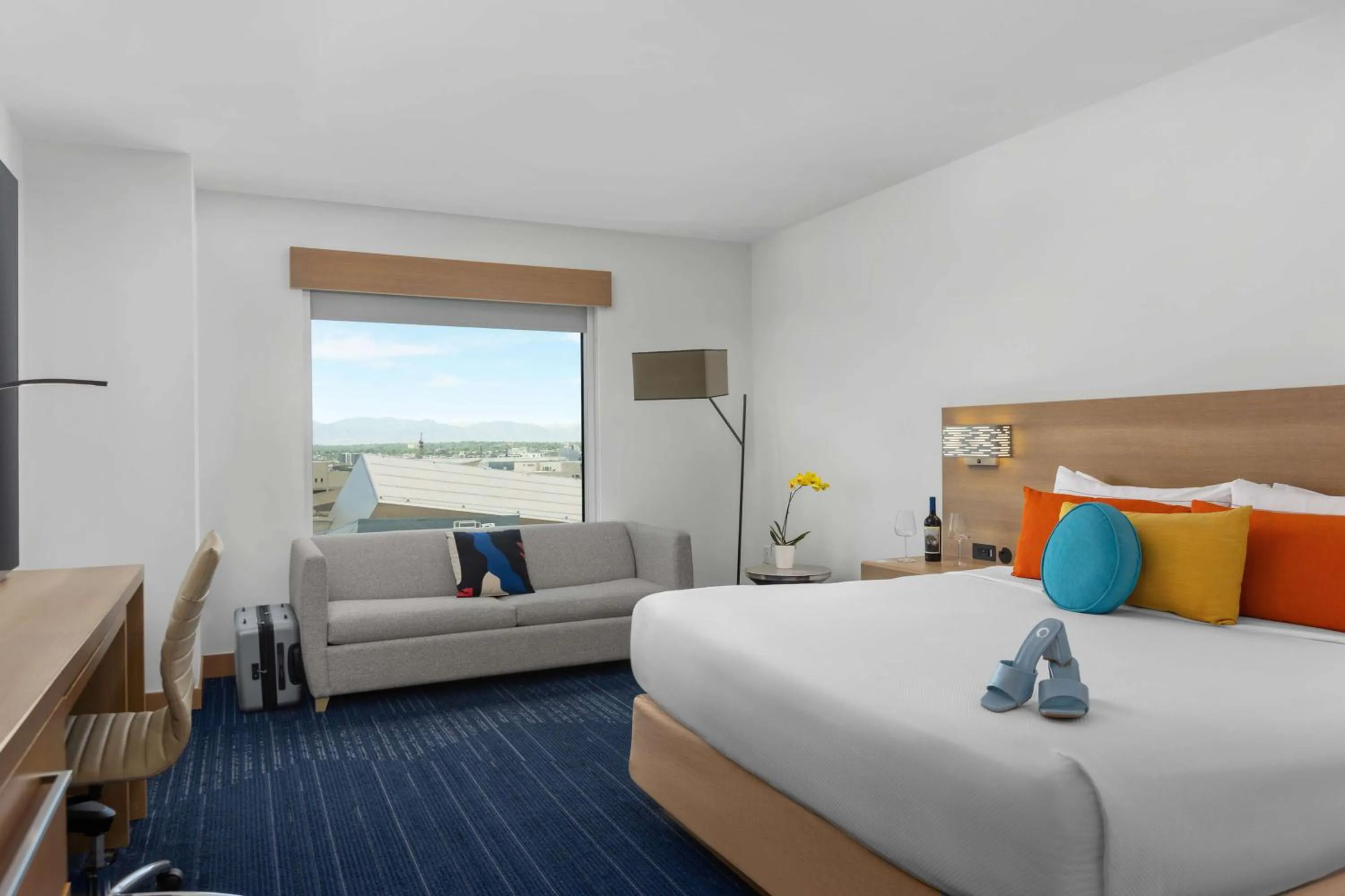 Living room, Bed in The Art Hotel Denver, Curio Collection by Hilton