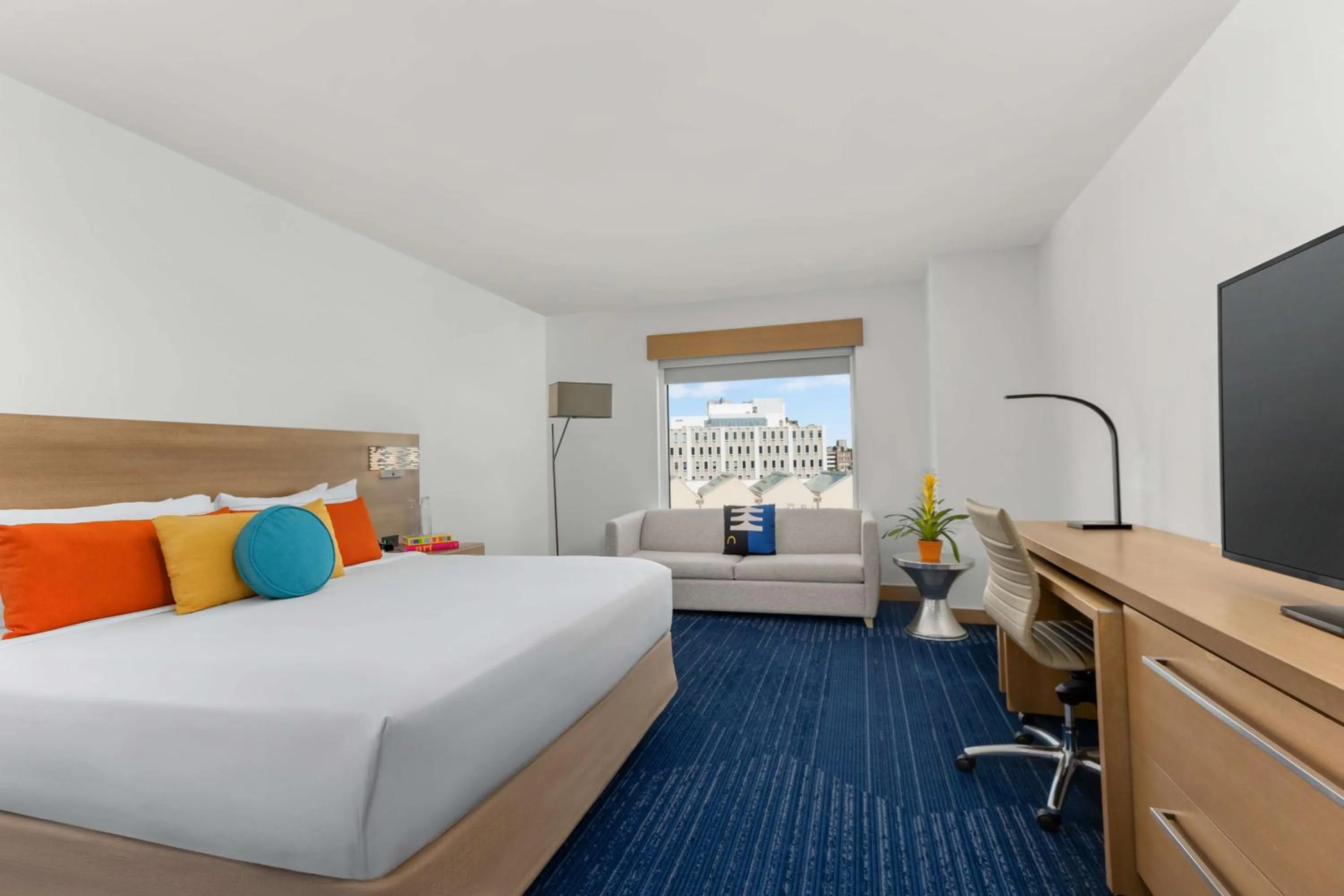 Living room, Bed in The Art Hotel Denver, Curio Collection by Hilton