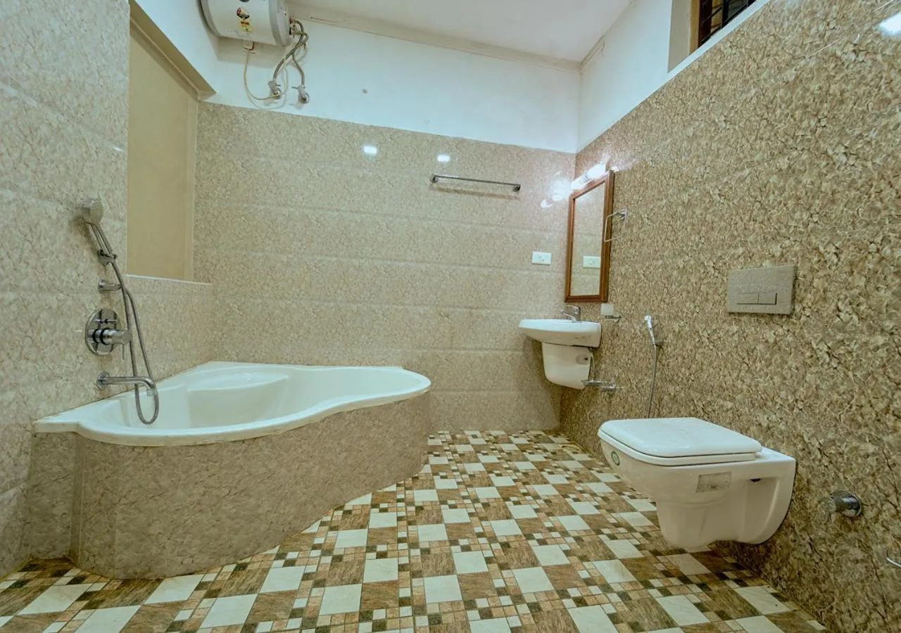 Shower in Ushasree Wayanad Premium Pool Resort by VOYE HOMES