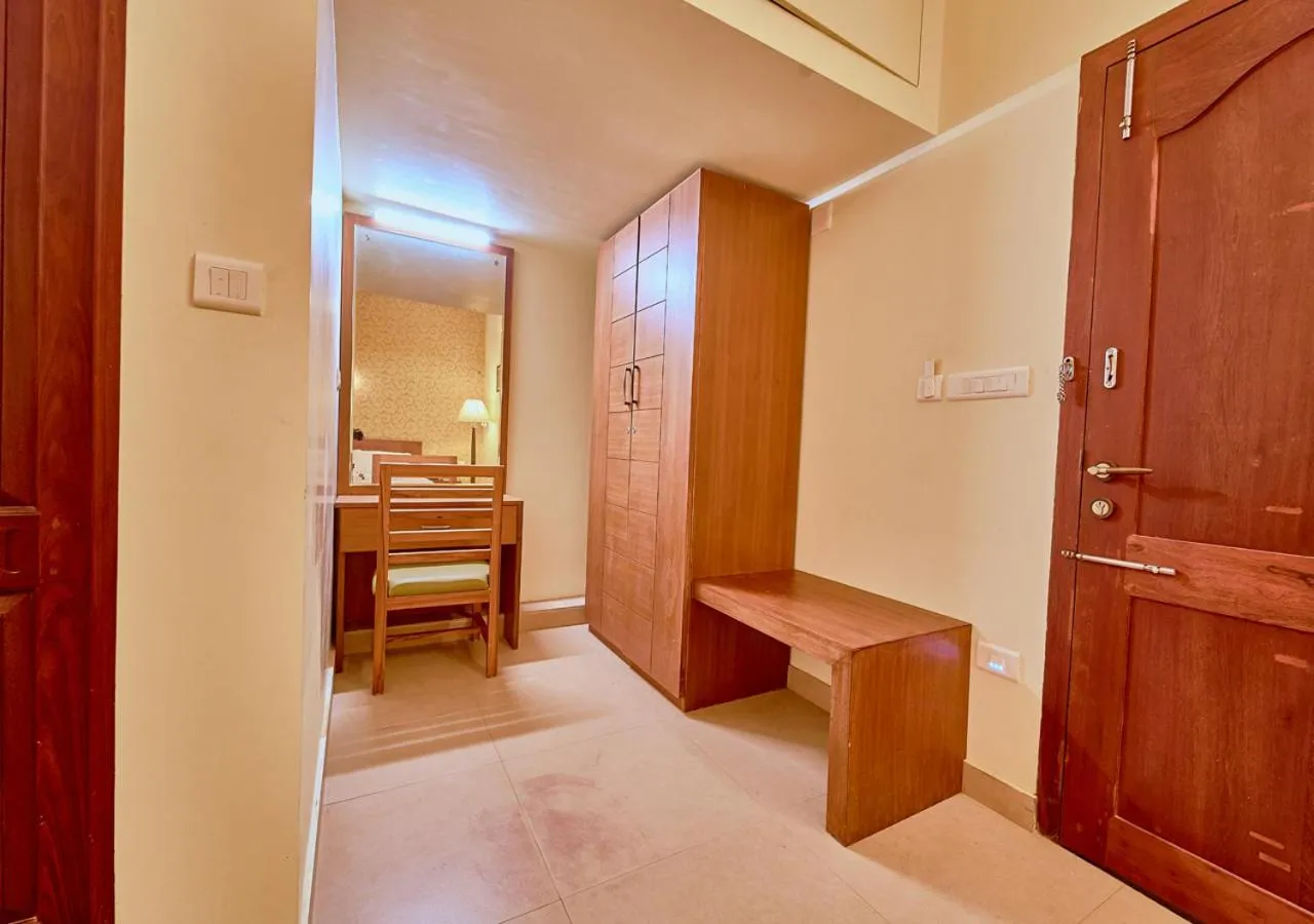 wardrobe, Bed in Ushasree Wayanad Premium Pool Resort by VOYE HOMES