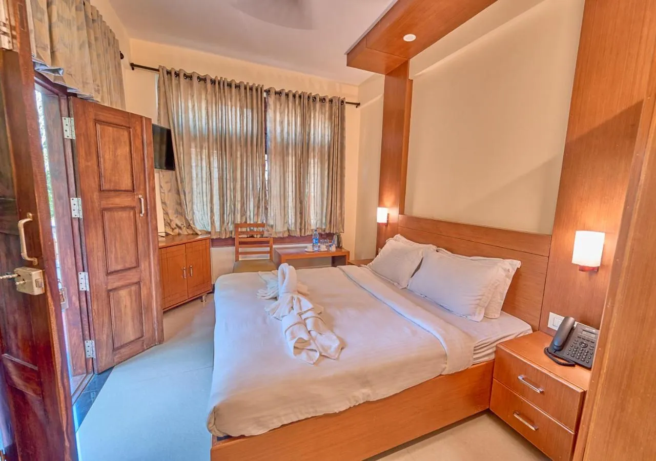 Bed in Ushasree Wayanad Premium Pool Resort by VOYE HOMES