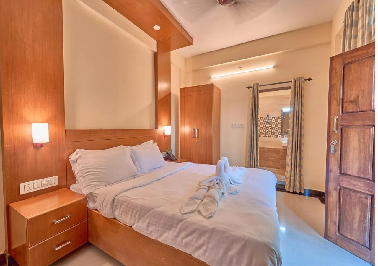 Bed in Ushasree Wayanad Premium Pool Resort by VOYE HOMES