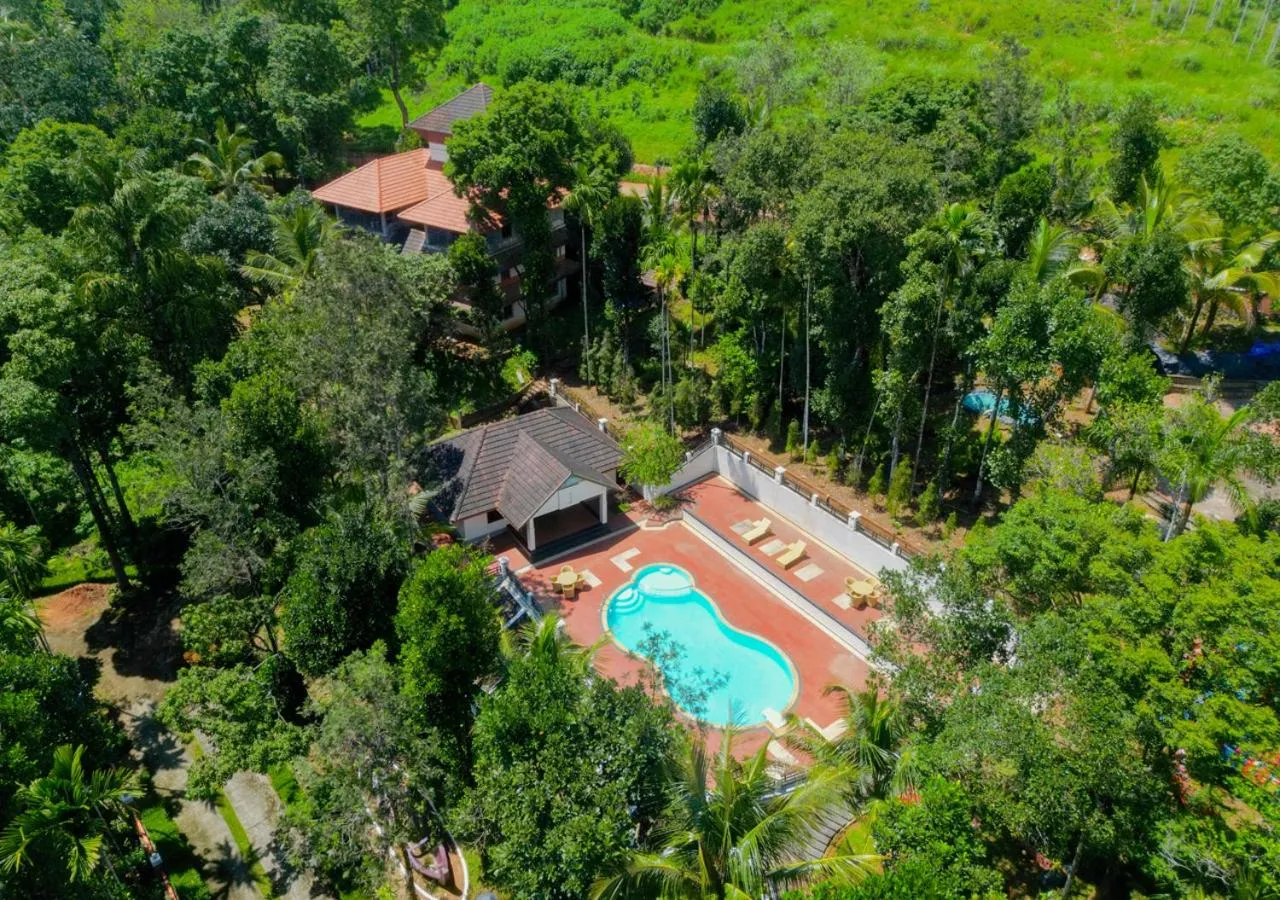 Property building in Ushasree Wayanad Premium Pool Resort by VOYE HOMES