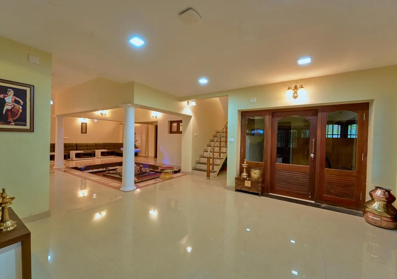 Seating area in Ushasree Wayanad Premium Pool Resort by VOYE HOMES