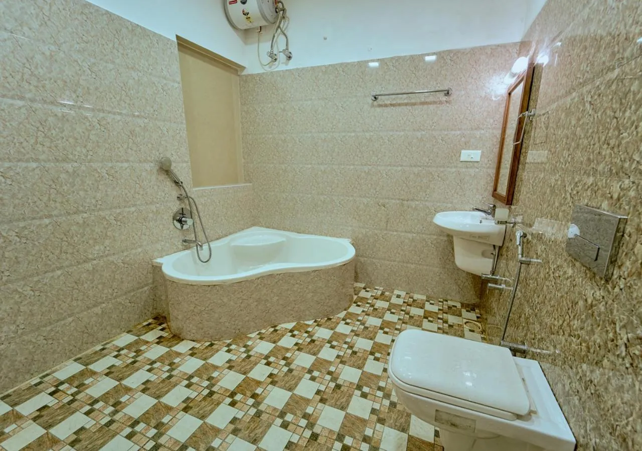 Shower in Ushasree Wayanad Premium Pool Resort by VOYE HOMES