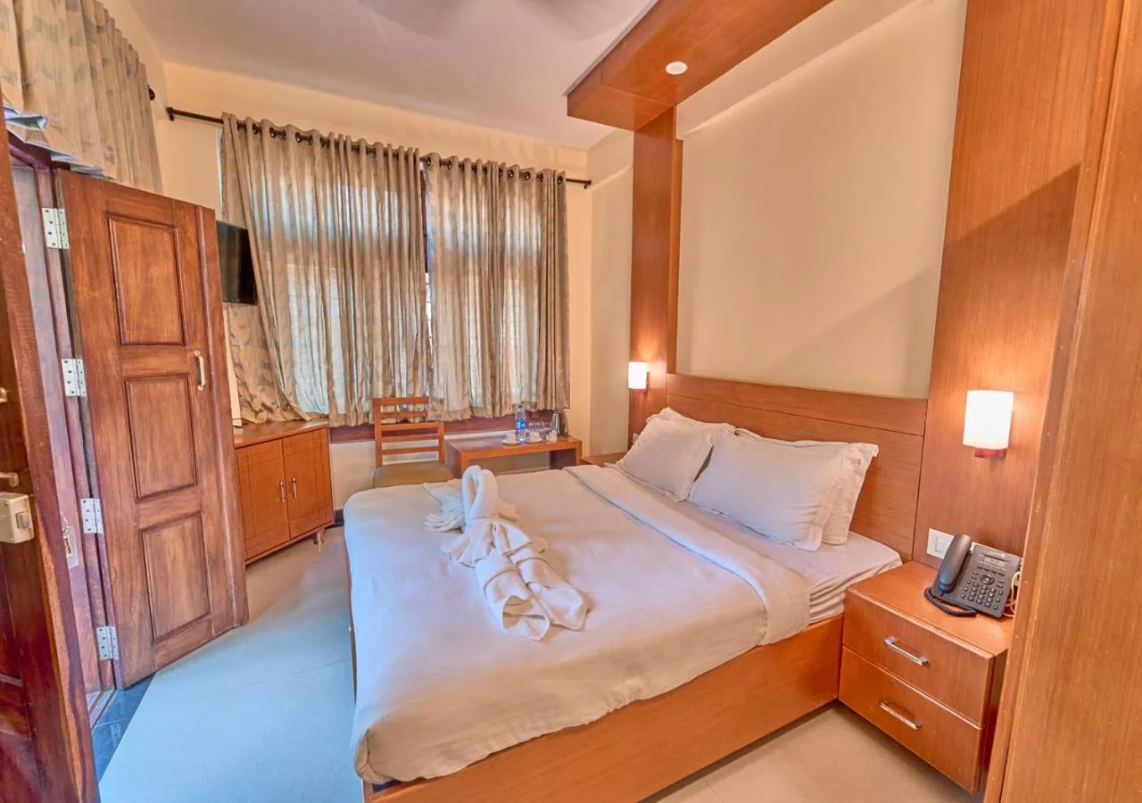 Bed in Ushasree Wayanad Premium Pool Resort by VOYE HOMES