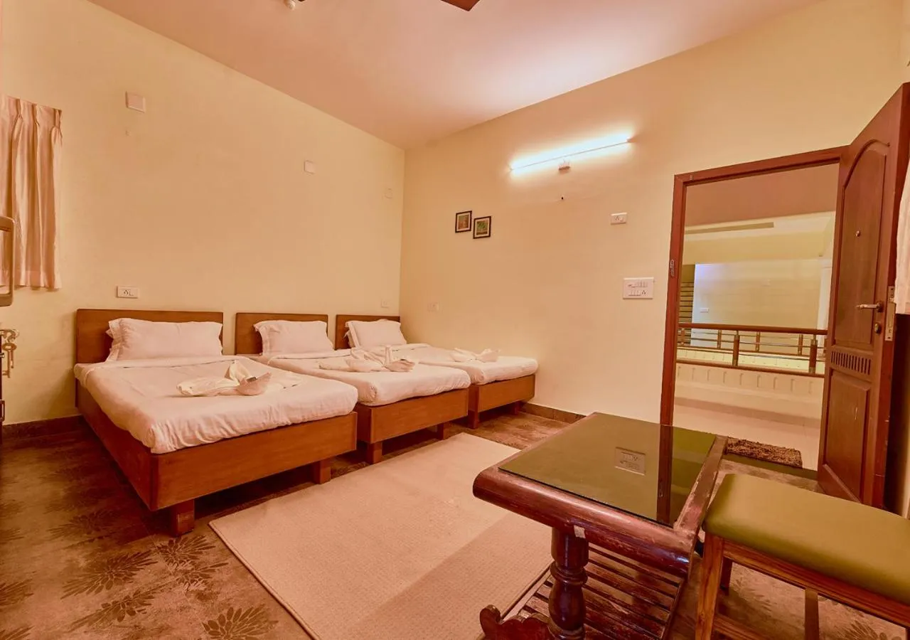 Bed in Ushasree Wayanad Premium Pool Resort by VOYE HOMES