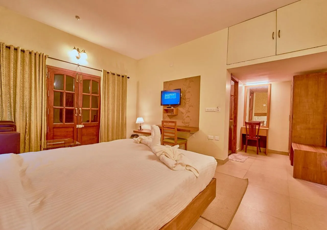 Bed in Ushasree Wayanad Premium Pool Resort by VOYE HOMES