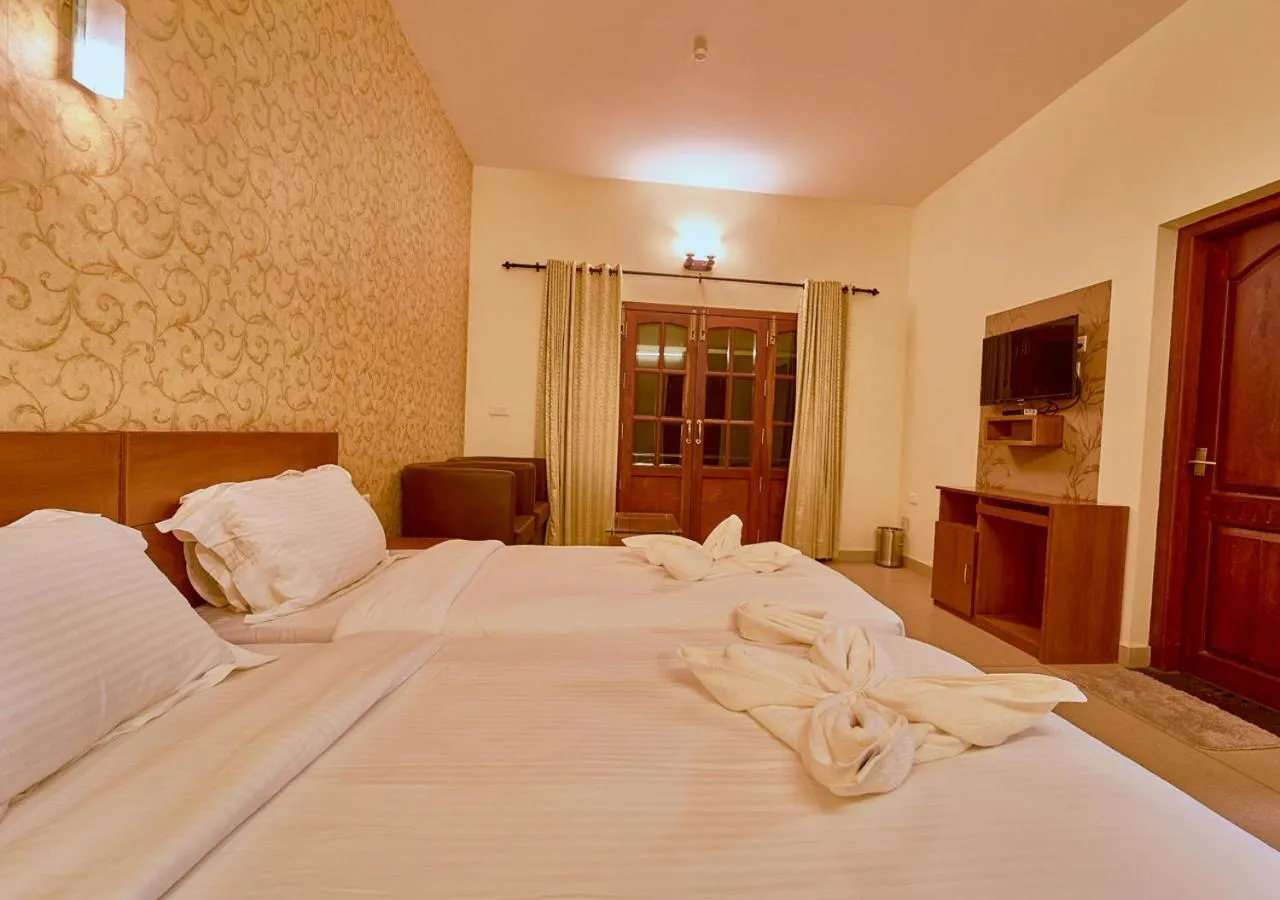 Bed in Ushasree Wayanad Premium Pool Resort by VOYE HOMES