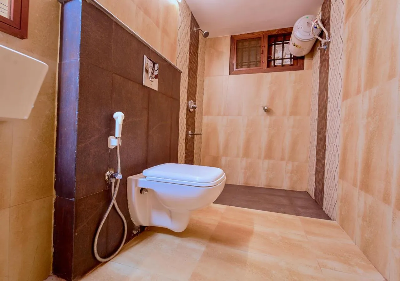 Shower in Ushasree Wayanad Premium Pool Resort by VOYE HOMES
