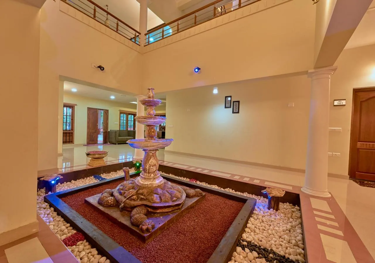 Seating area in Ushasree Wayanad Premium Pool Resort by VOYE HOMES