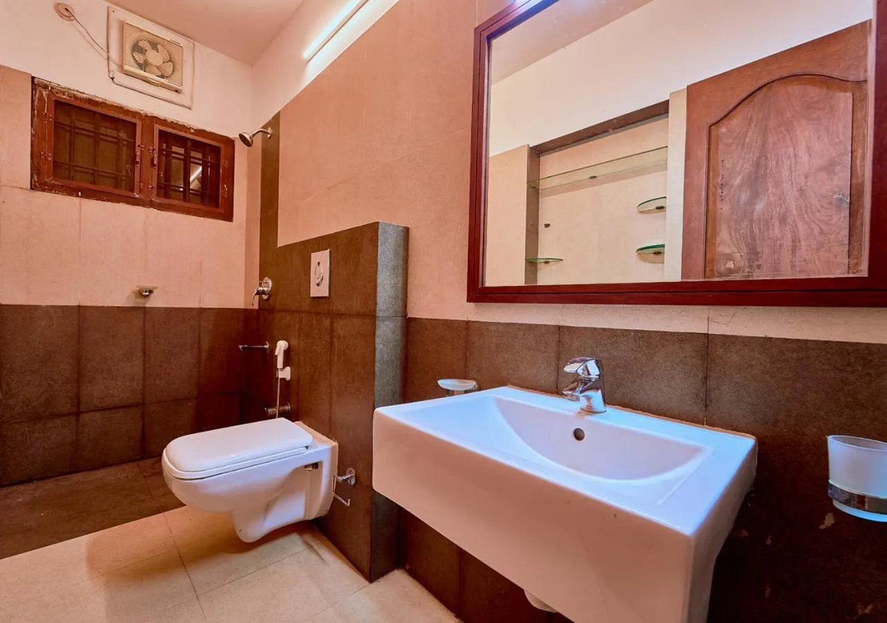 Bathroom in Ushasree Wayanad Premium Pool Resort by VOYE HOMES