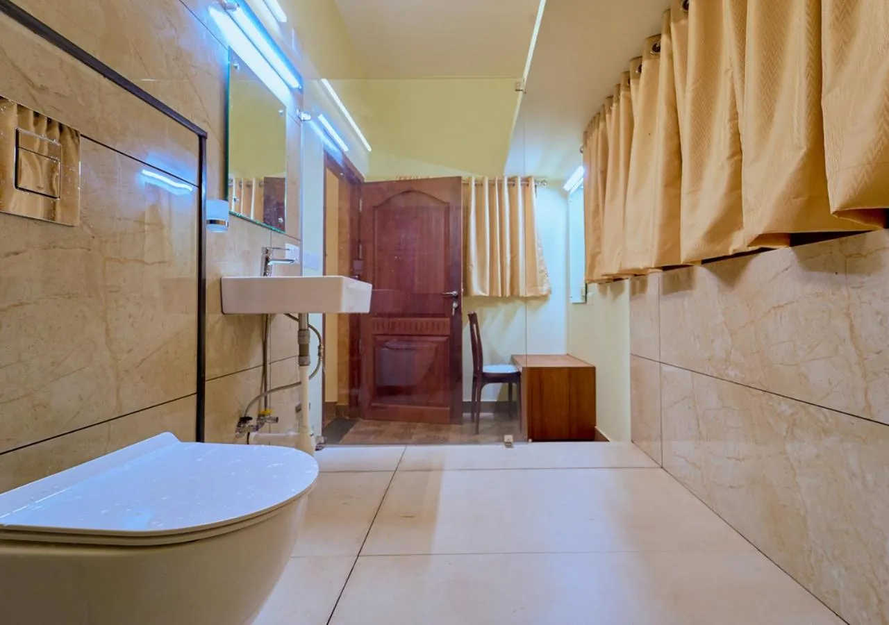 Shower in Ushasree Wayanad Premium Pool Resort by VOYE HOMES