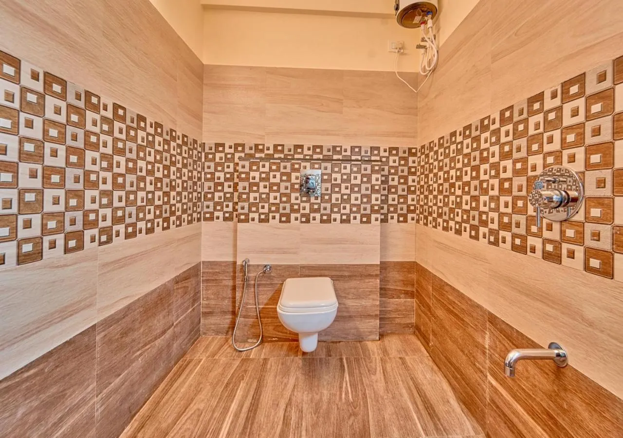 Shower in Ushasree Wayanad Premium Pool Resort by VOYE HOMES