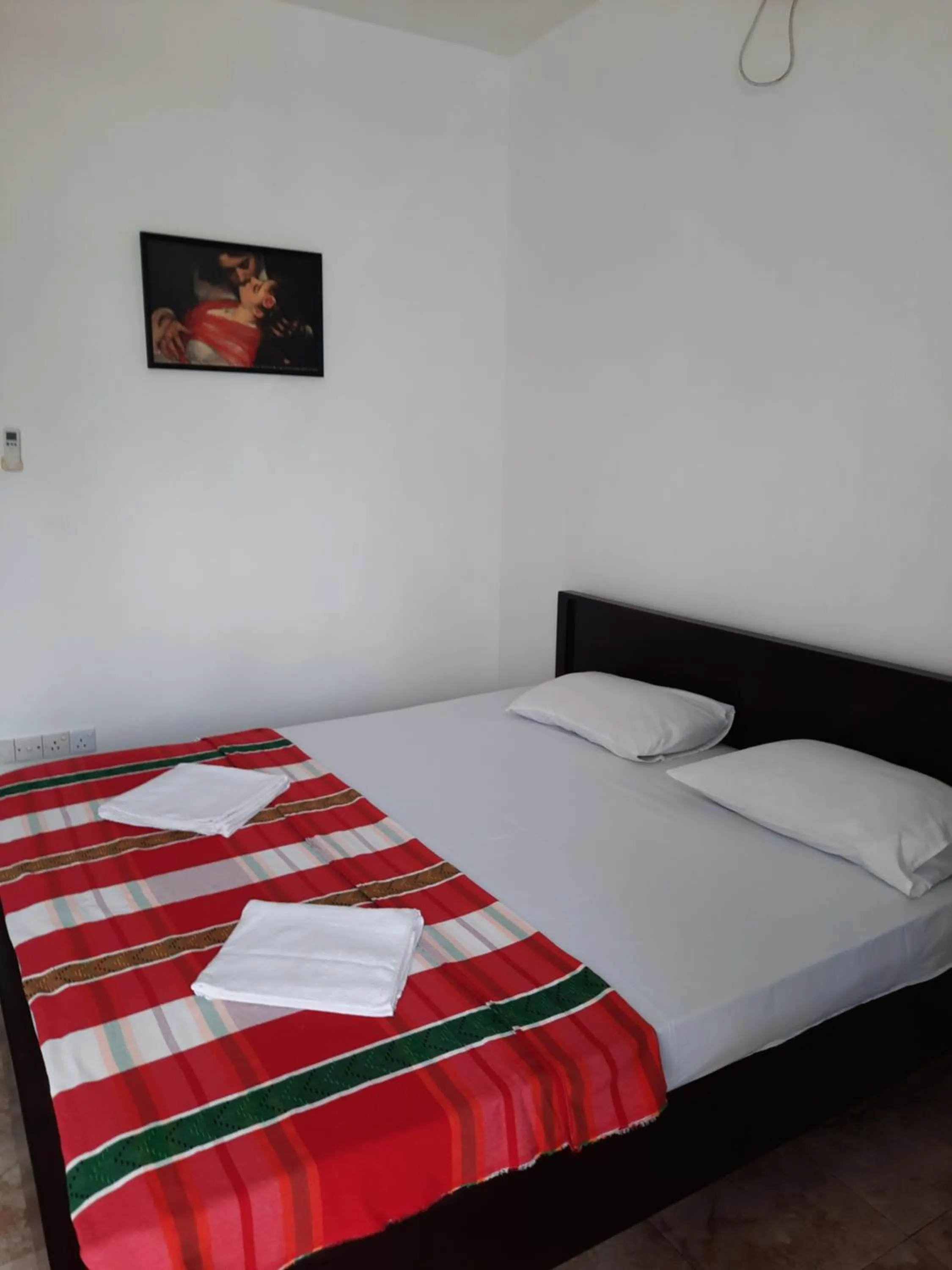 Bed in White Surfing Beach Resort