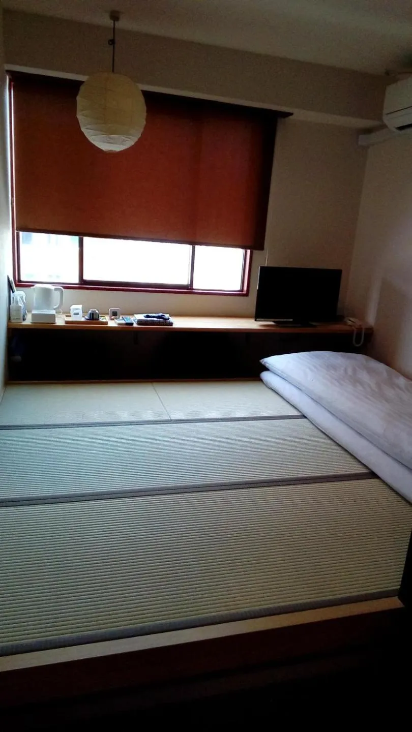 Bed in Business Hotel Atelier