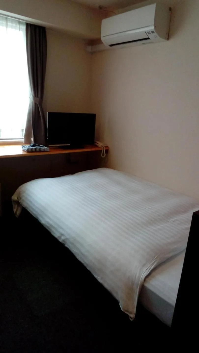 Bed in Business Hotel Atelier