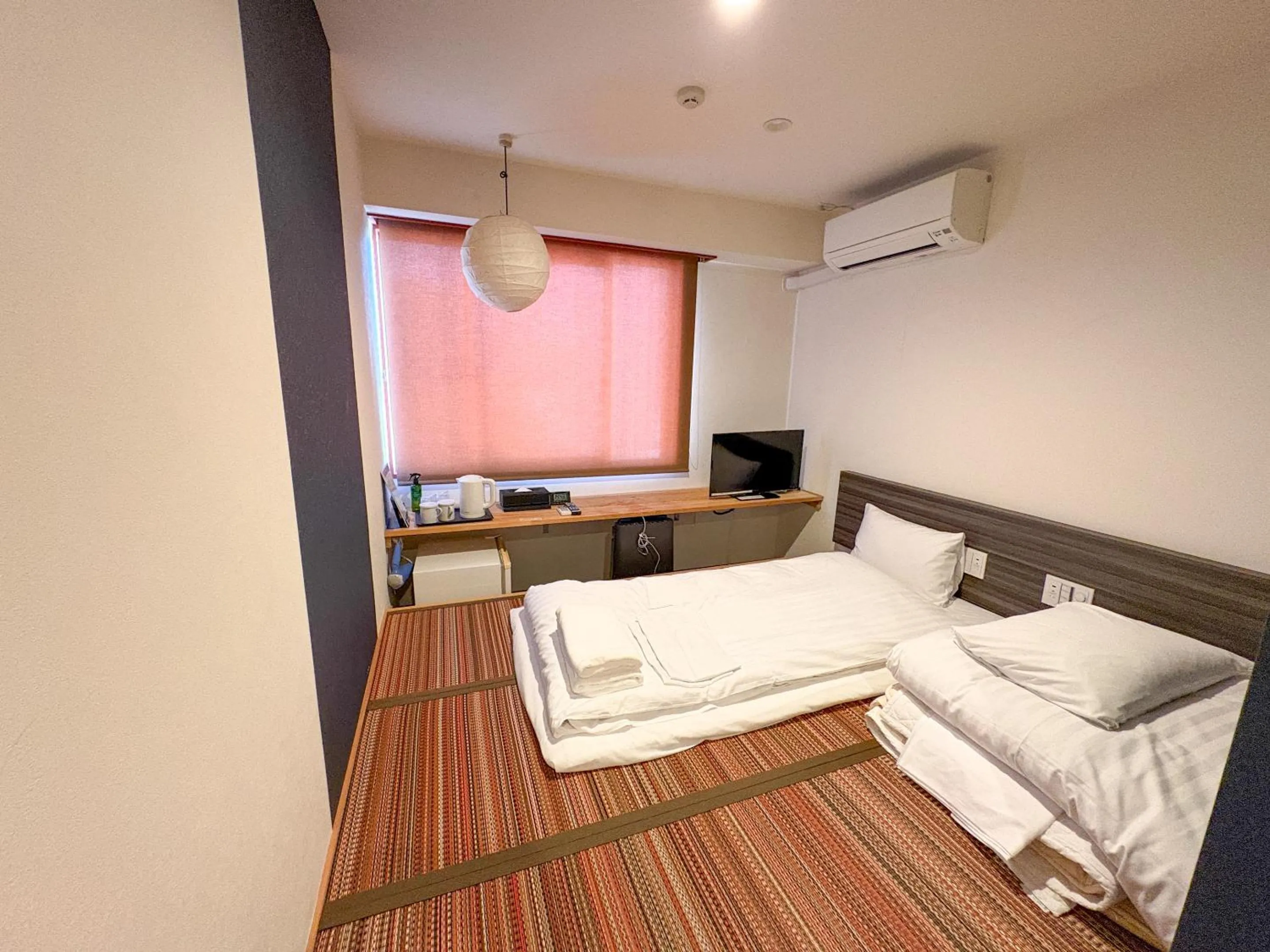 Bed in Hotel Livemax Budget Kagoshima Tenmonkan