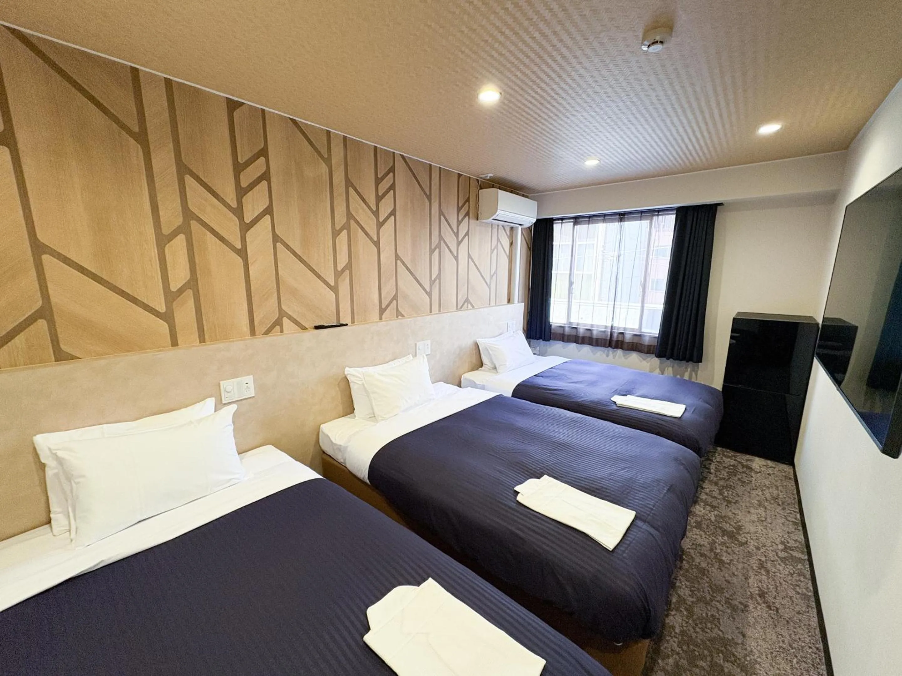 Bed in Hotel Livemax Budget Kagoshima Tenmonkan