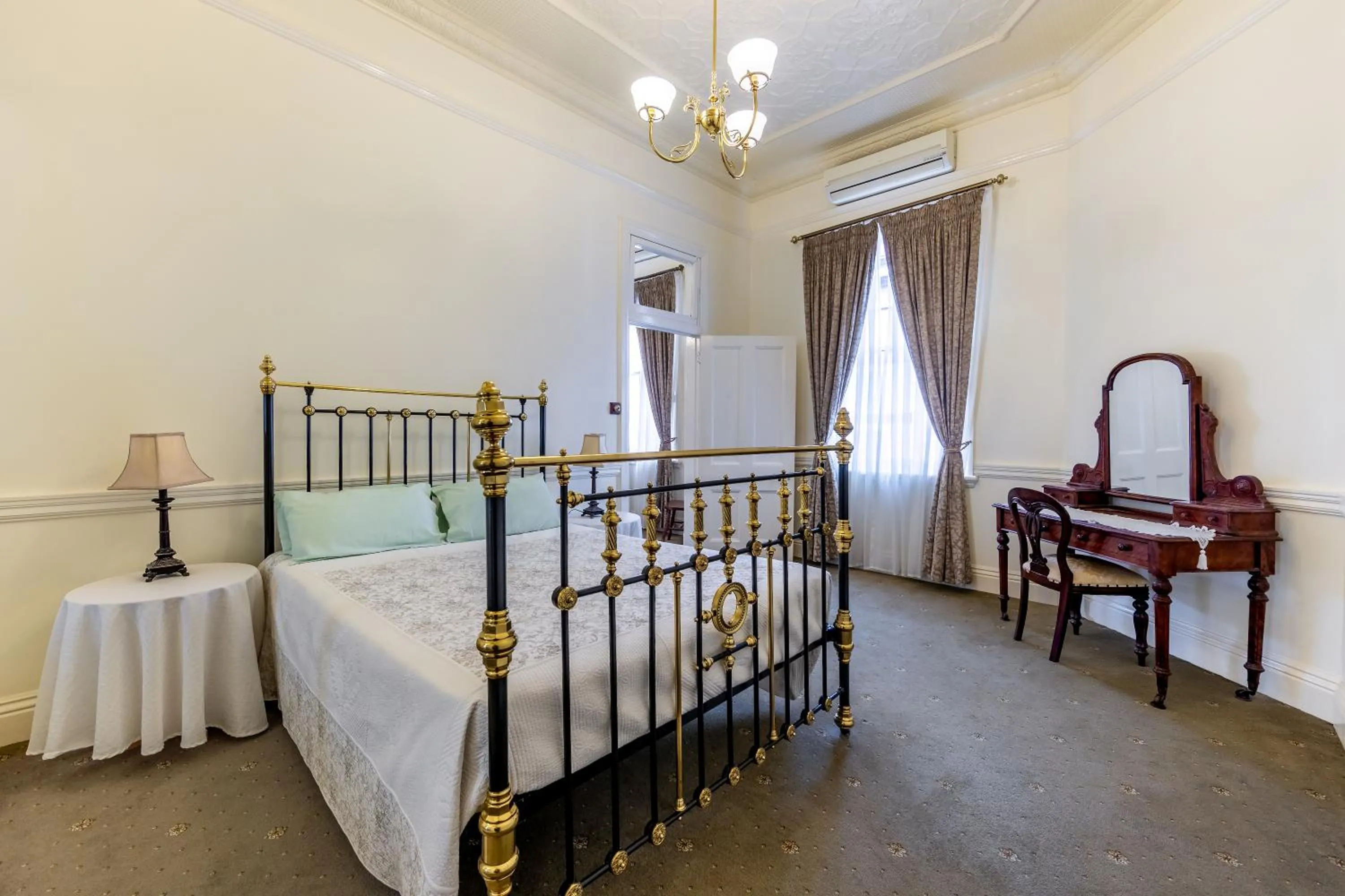 Bed in Criterion Warwick Hotel