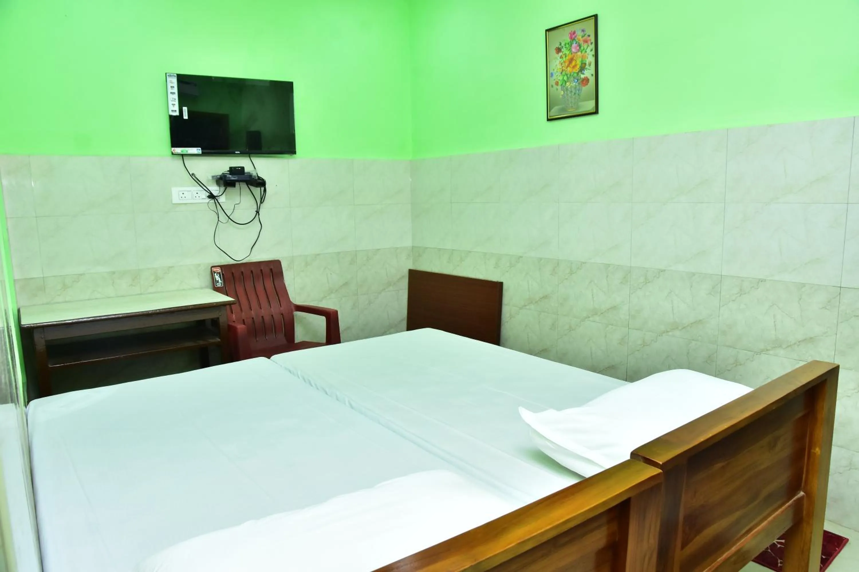 TV and multimedia, Bed in Sri Tirumalaa Hotel