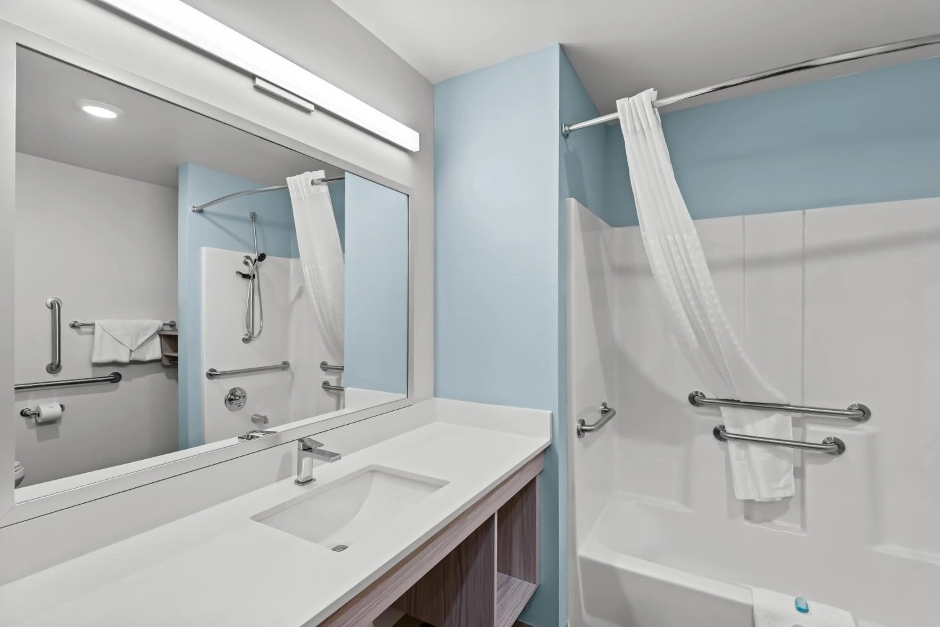 Bathroom in WoodSpring Suites Coralville Iowa City