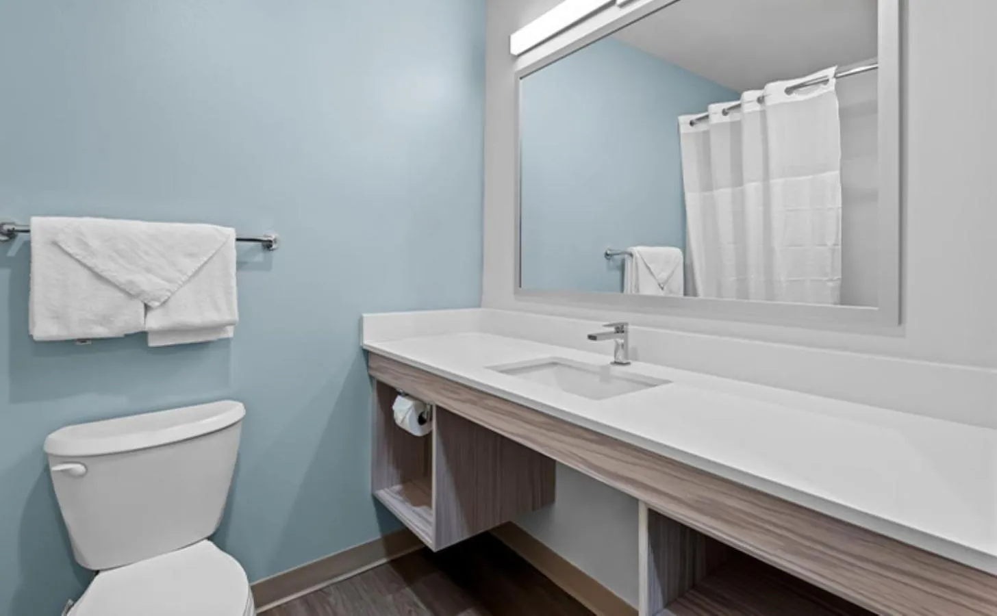Bathroom in WoodSpring Suites Coralville Iowa City