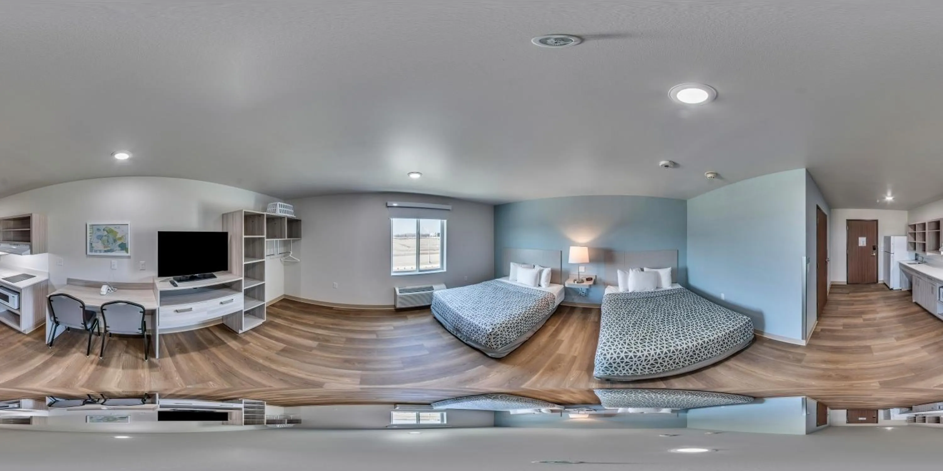 Bedroom in WoodSpring Suites Coralville Iowa City