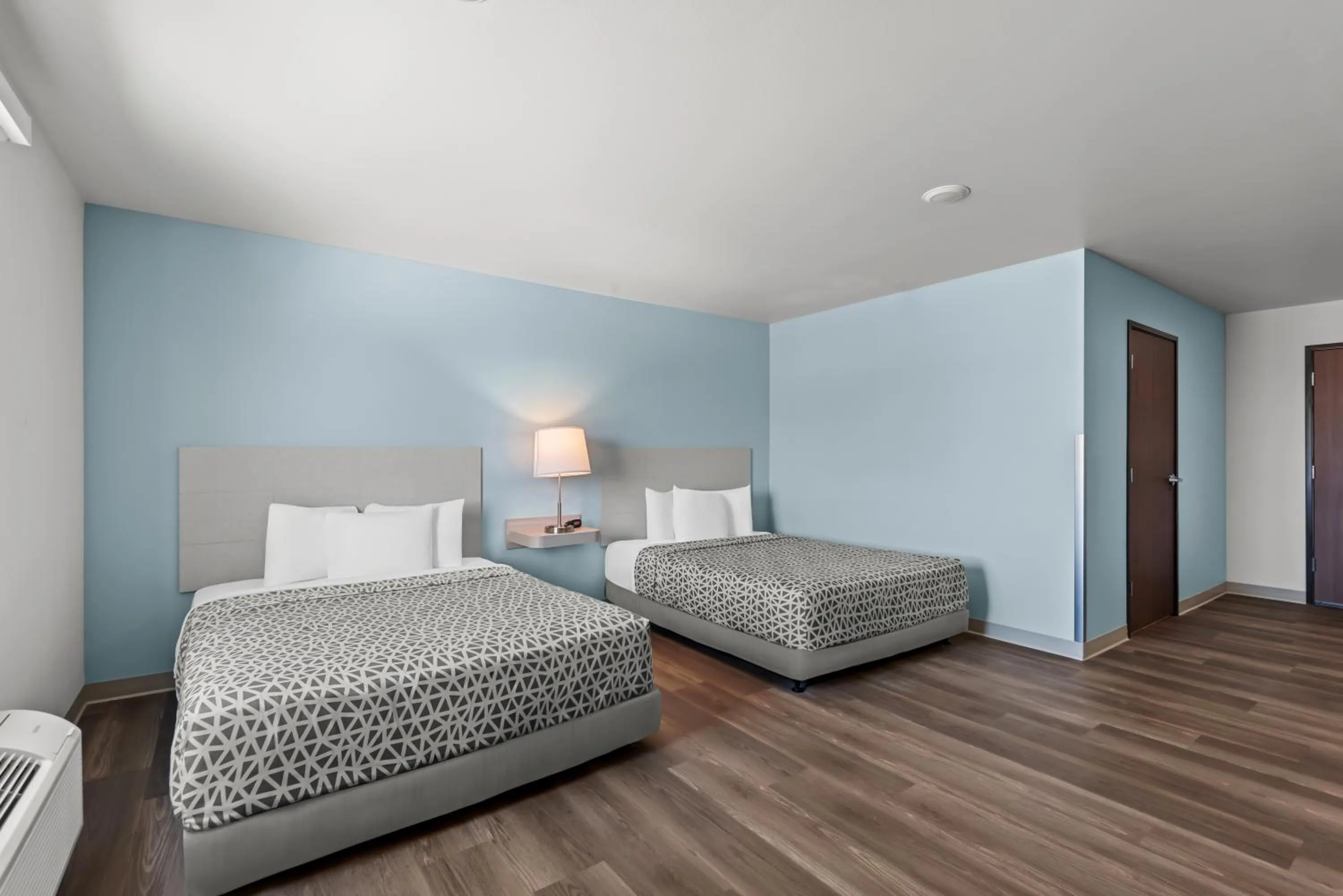 Bed in WoodSpring Suites Coralville Iowa City