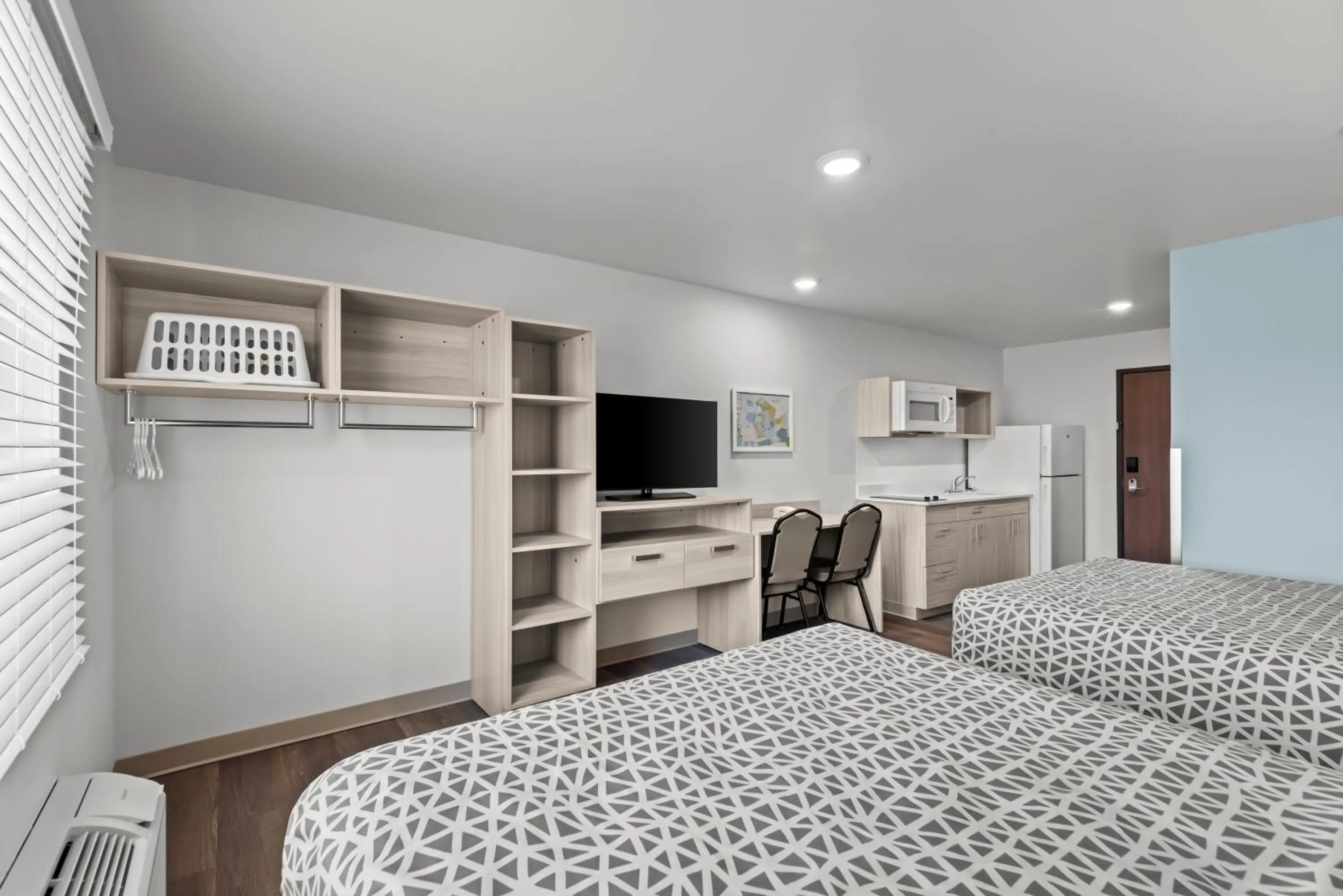 Bed in WoodSpring Suites Coralville Iowa City