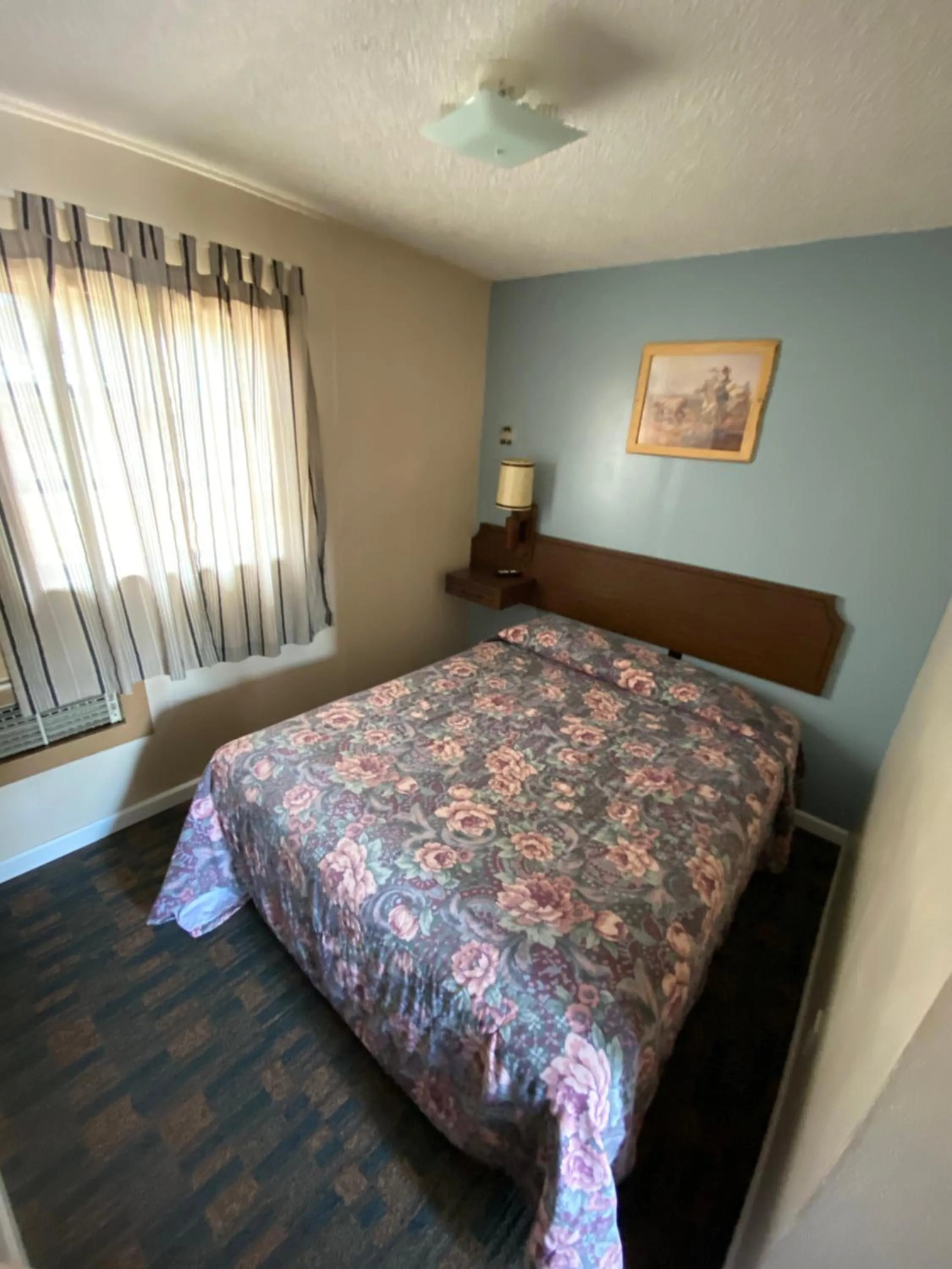 Bed in Rainbow Motel