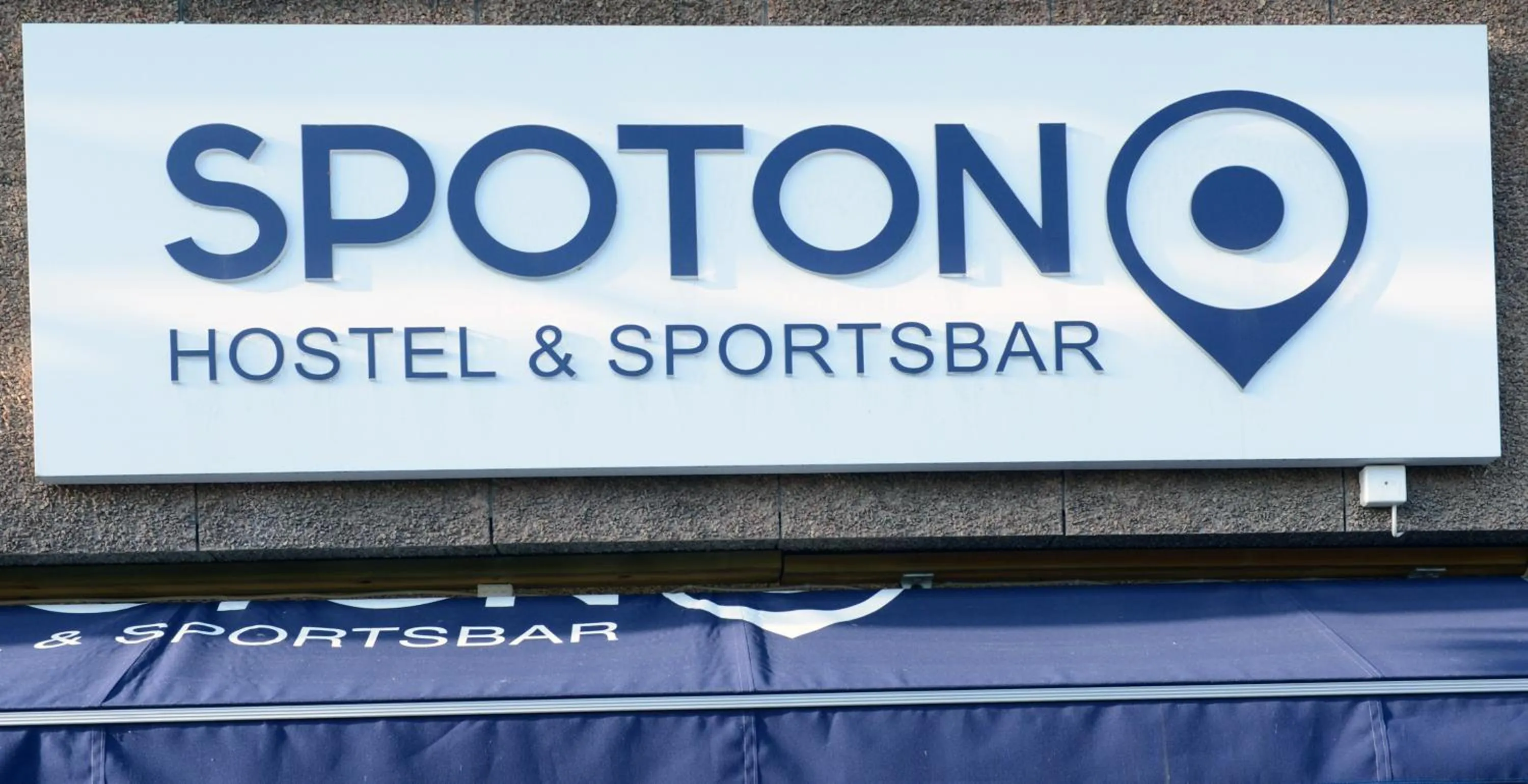 Property logo or sign in Spoton Hostel & Sportsbar