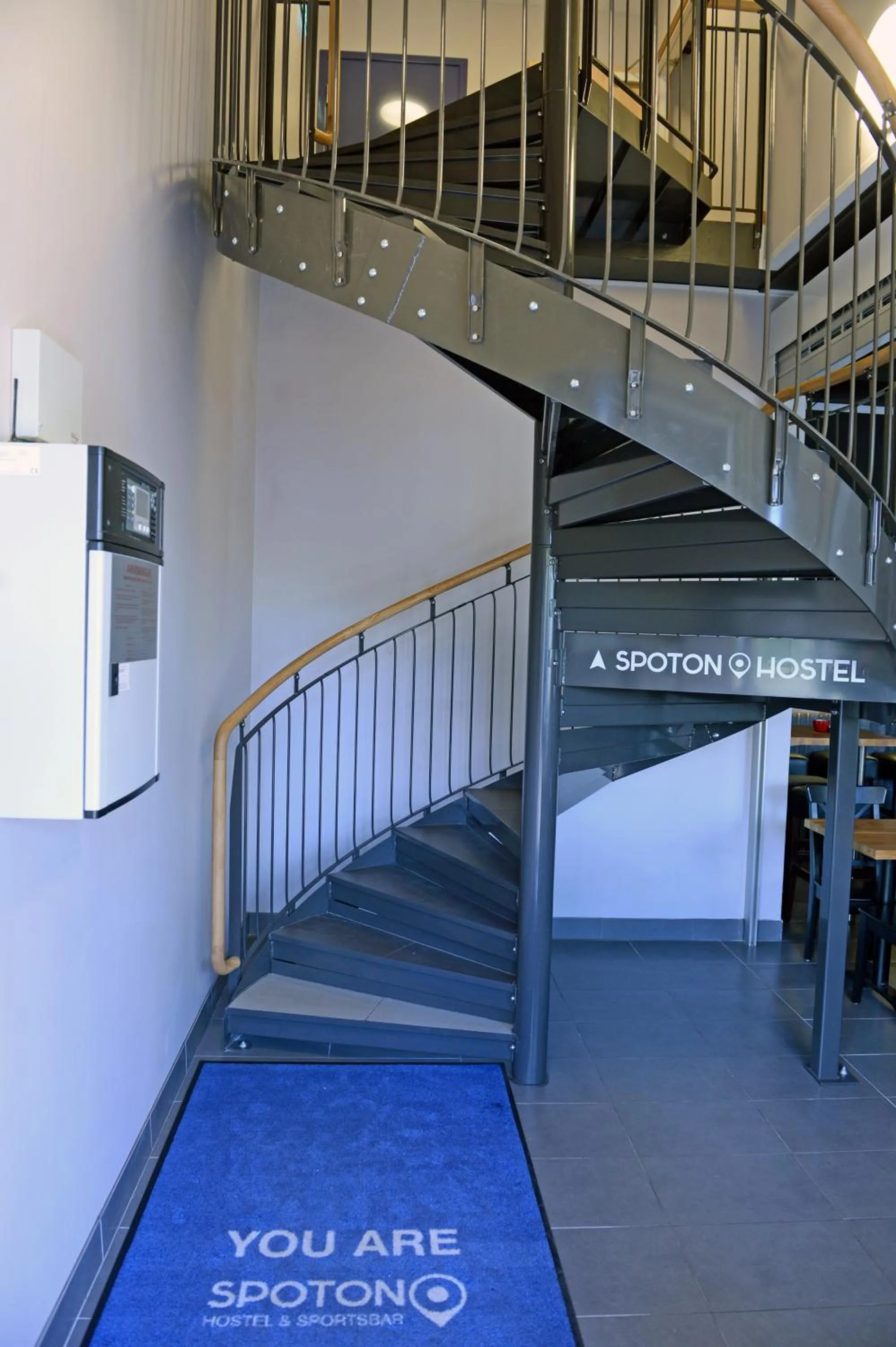 Property logo or sign in Spoton Hostel & Sportsbar