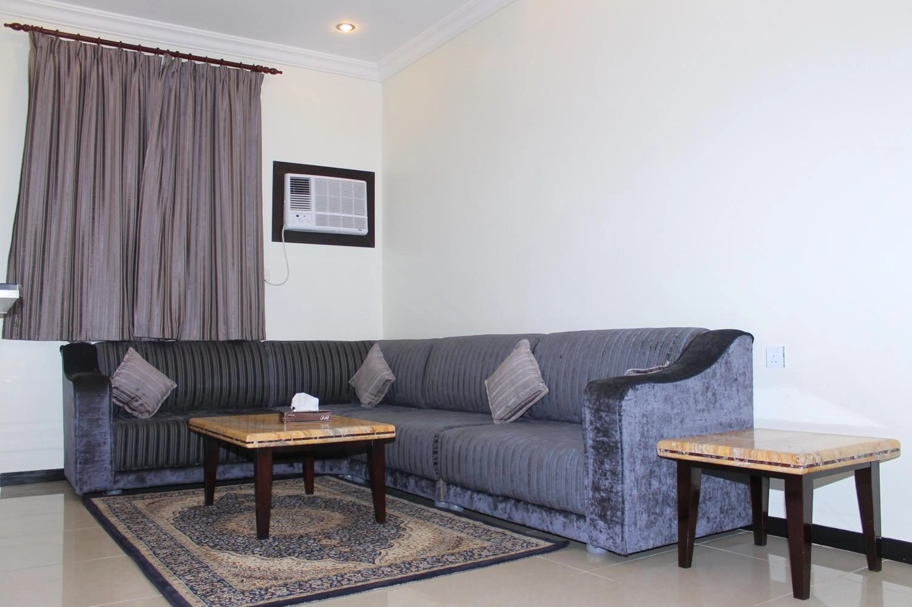 Living room in فخامة الديار للشقق المخدومة Fakhamat Aldyar For Serviced Apartments