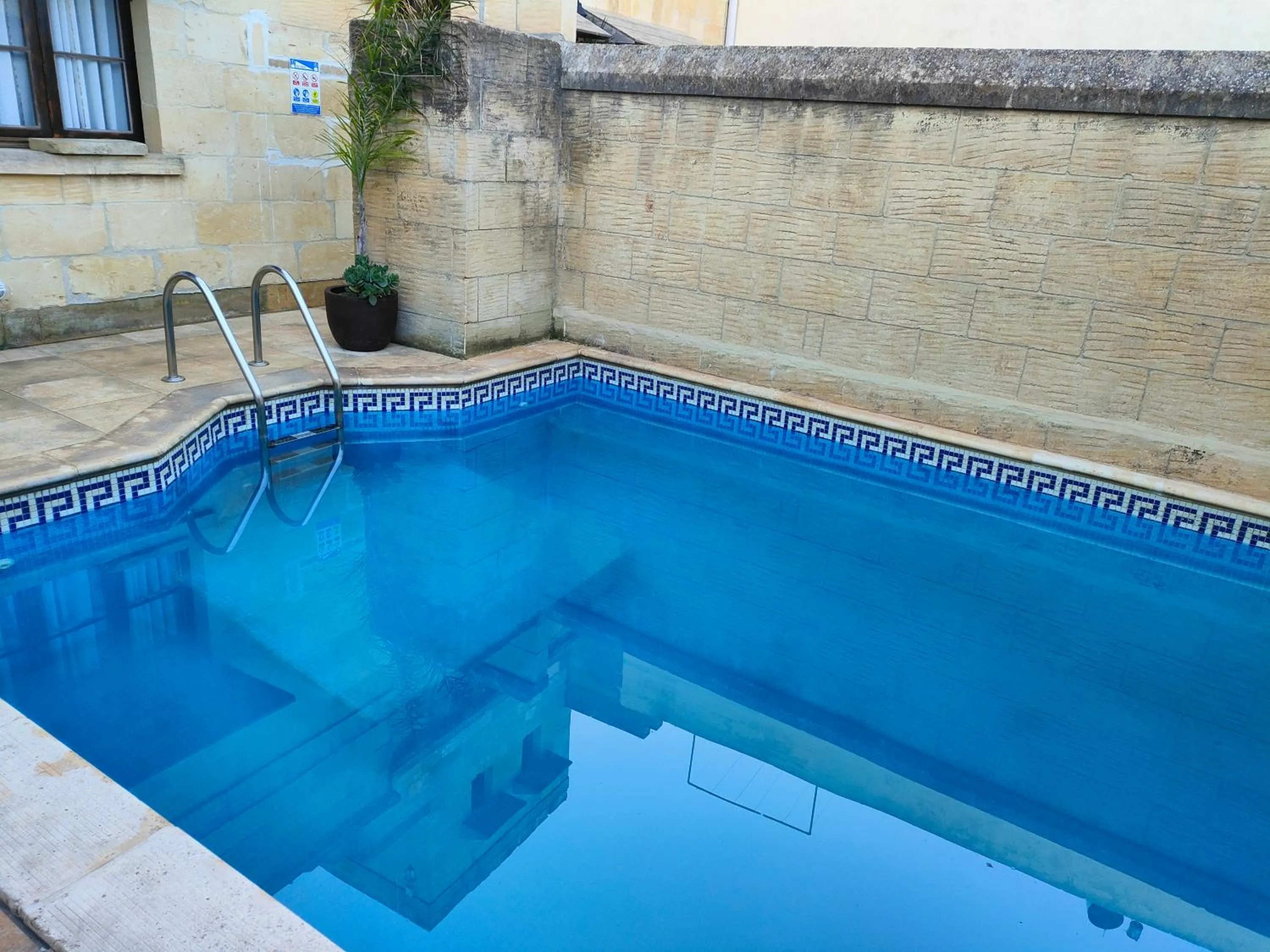 Pool view in Grotto's Paradise B&B