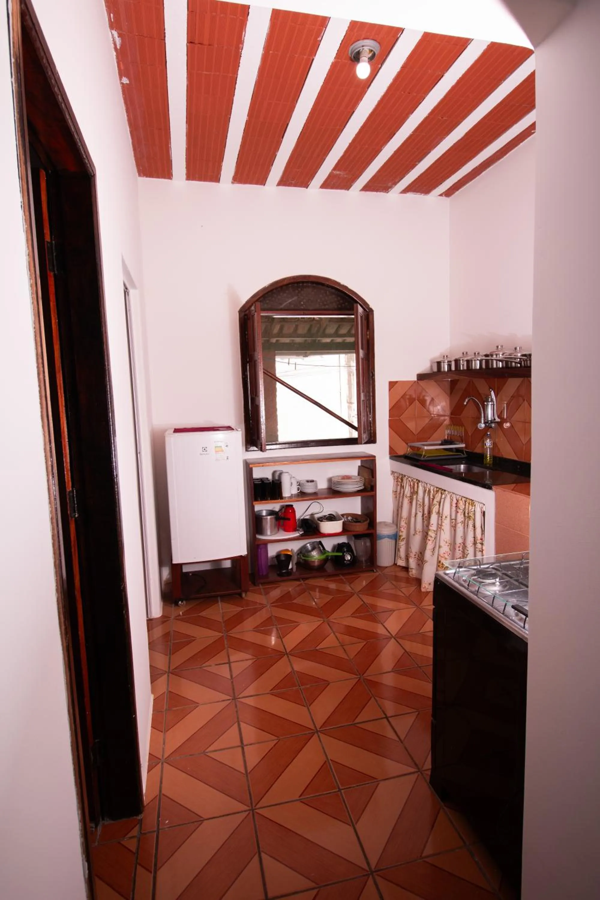 Kitchen or kitchenette in Pousada do Mineiro