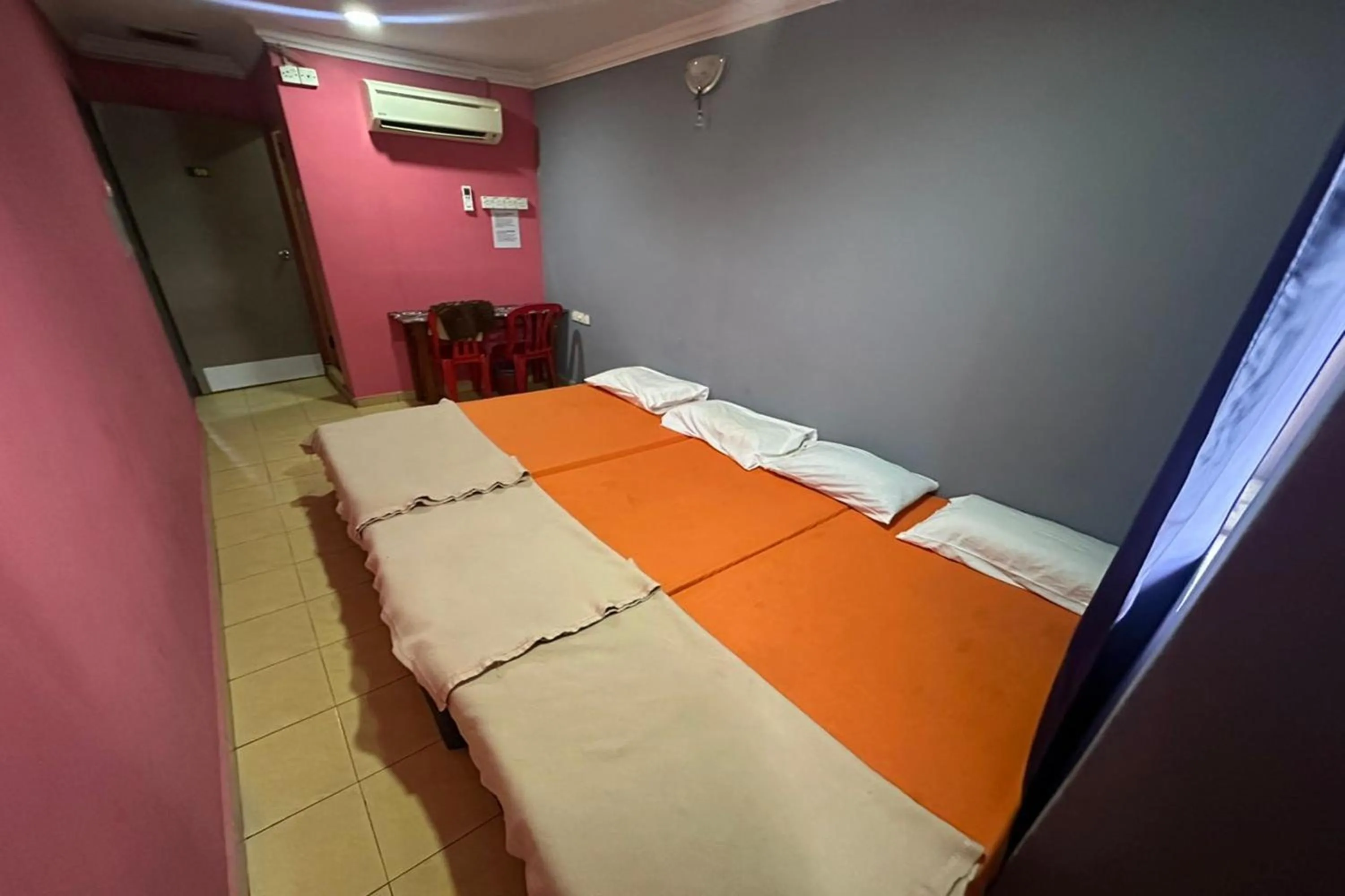 Bed in I Rose Budget Hotel