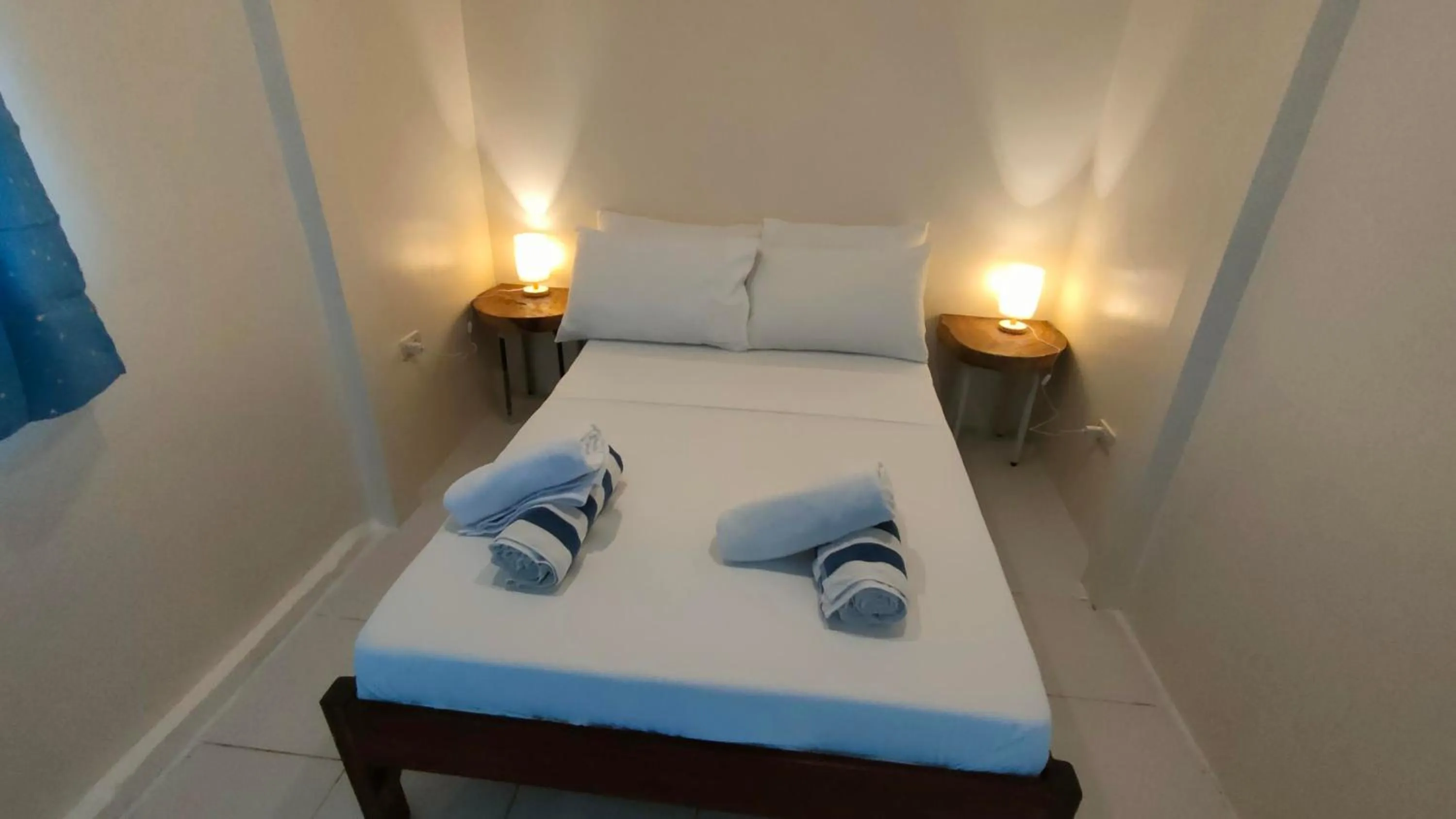 Bed in Isla Hayahay Beach Resort and Restaurant