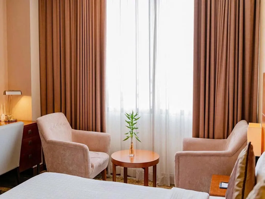 Seating area, Bed in AURORA Hotel Plaza