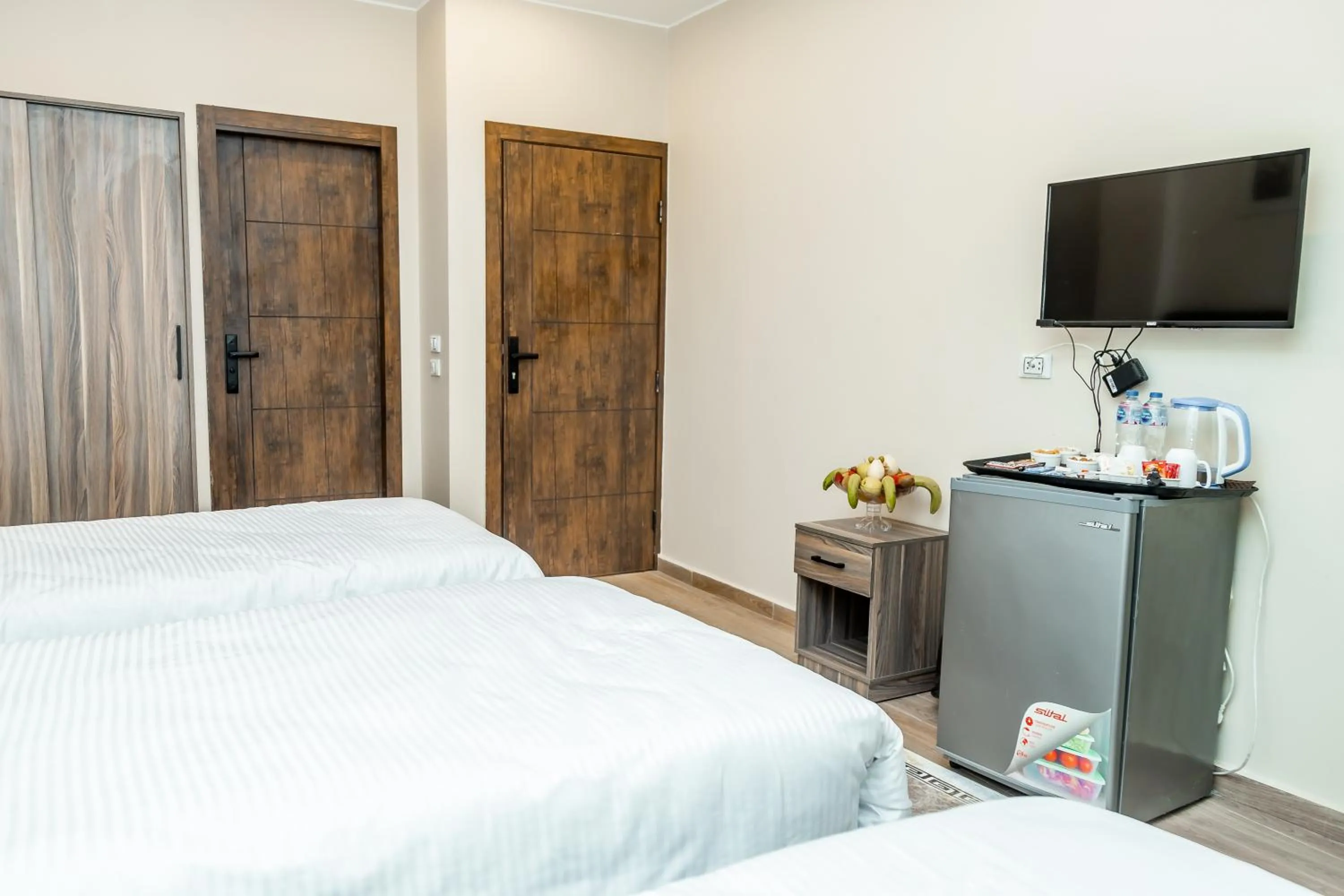 Bed in Night Pyramids Inn Hotel