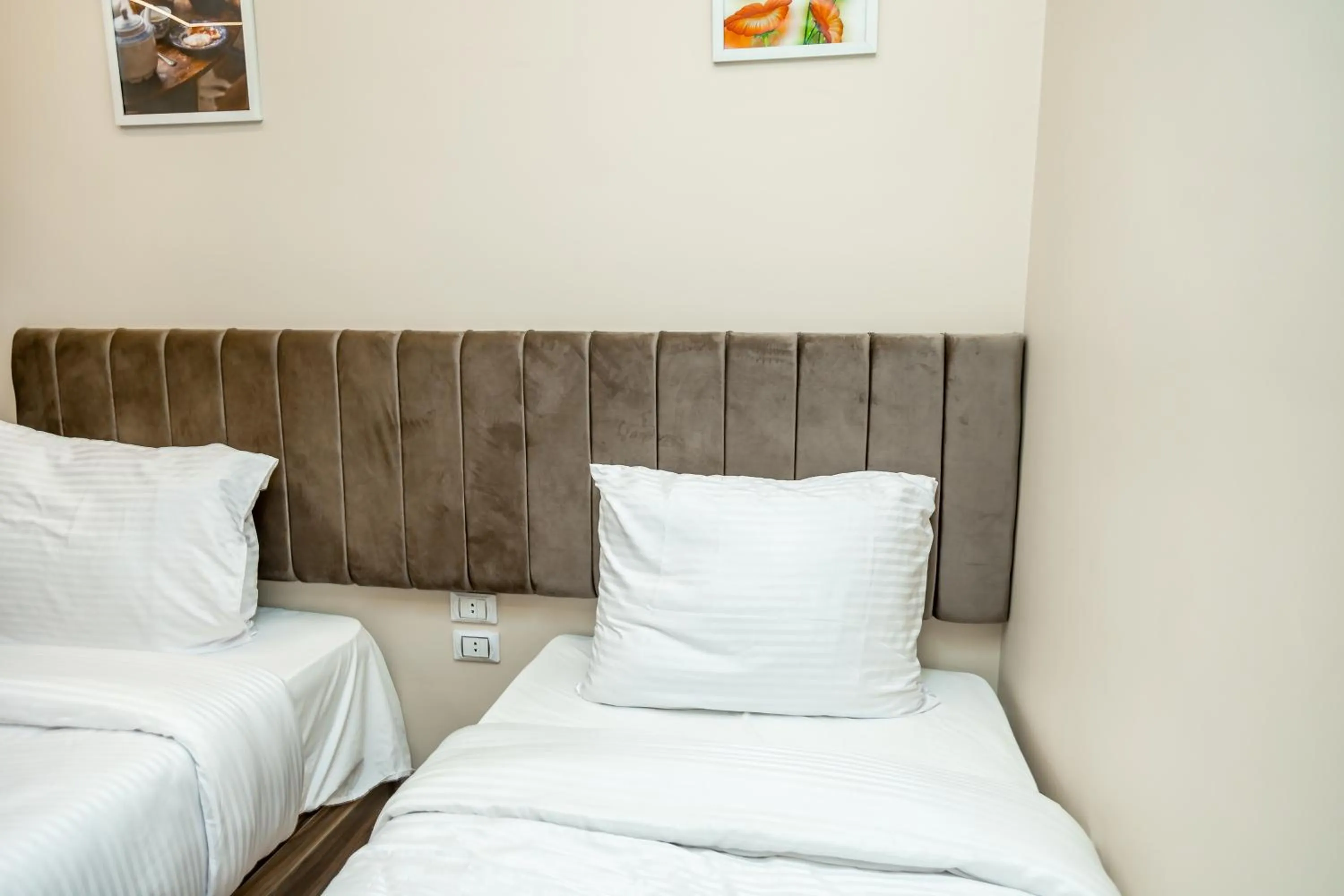 Bed in Night Pyramids Inn Hotel