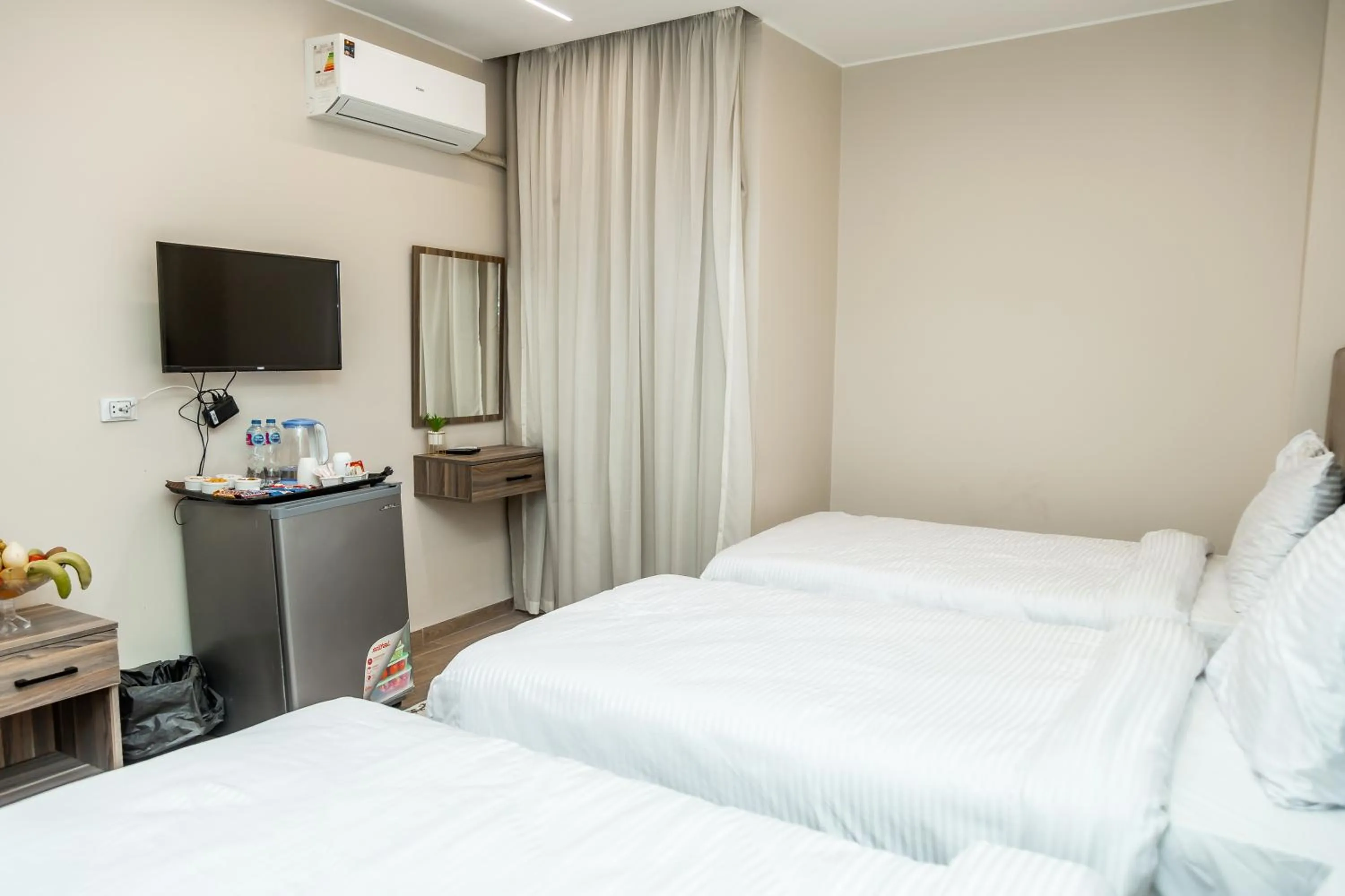 Communal lounge/ TV room, Bed in Night Pyramids Inn Hotel