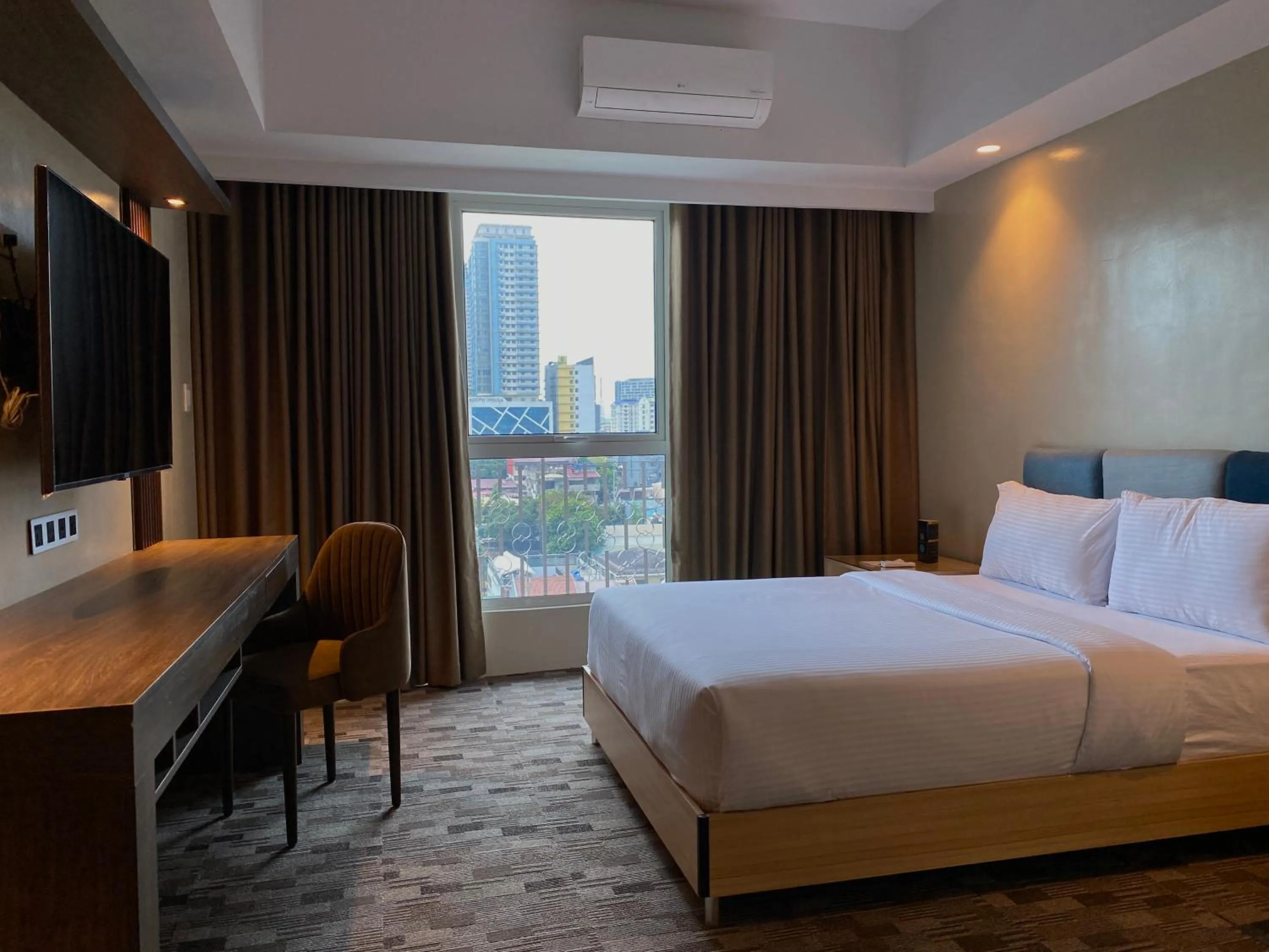 Bed in The Tribute Hotel