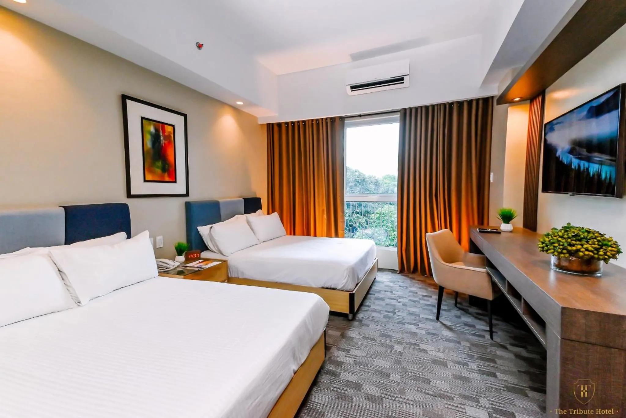 Bed in The Tribute Hotel